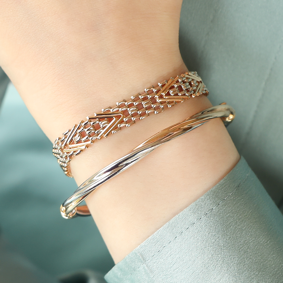Model wears 14ct Yellow & White Gold 7.5" Chevron Gate Bracelet & 9ct Two Colour Gold Plain Twisted Tension Bangle