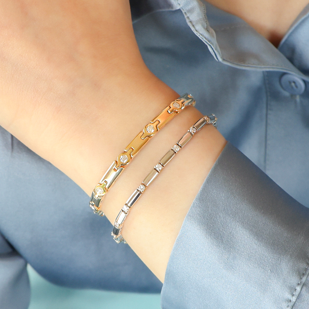 Model wears 9ct Yellow Gold Diamond Bezel Set Round Link & Bar Bracelet & 9ct Yellow & White Gold Diamond Claw Set Bar Bracelet