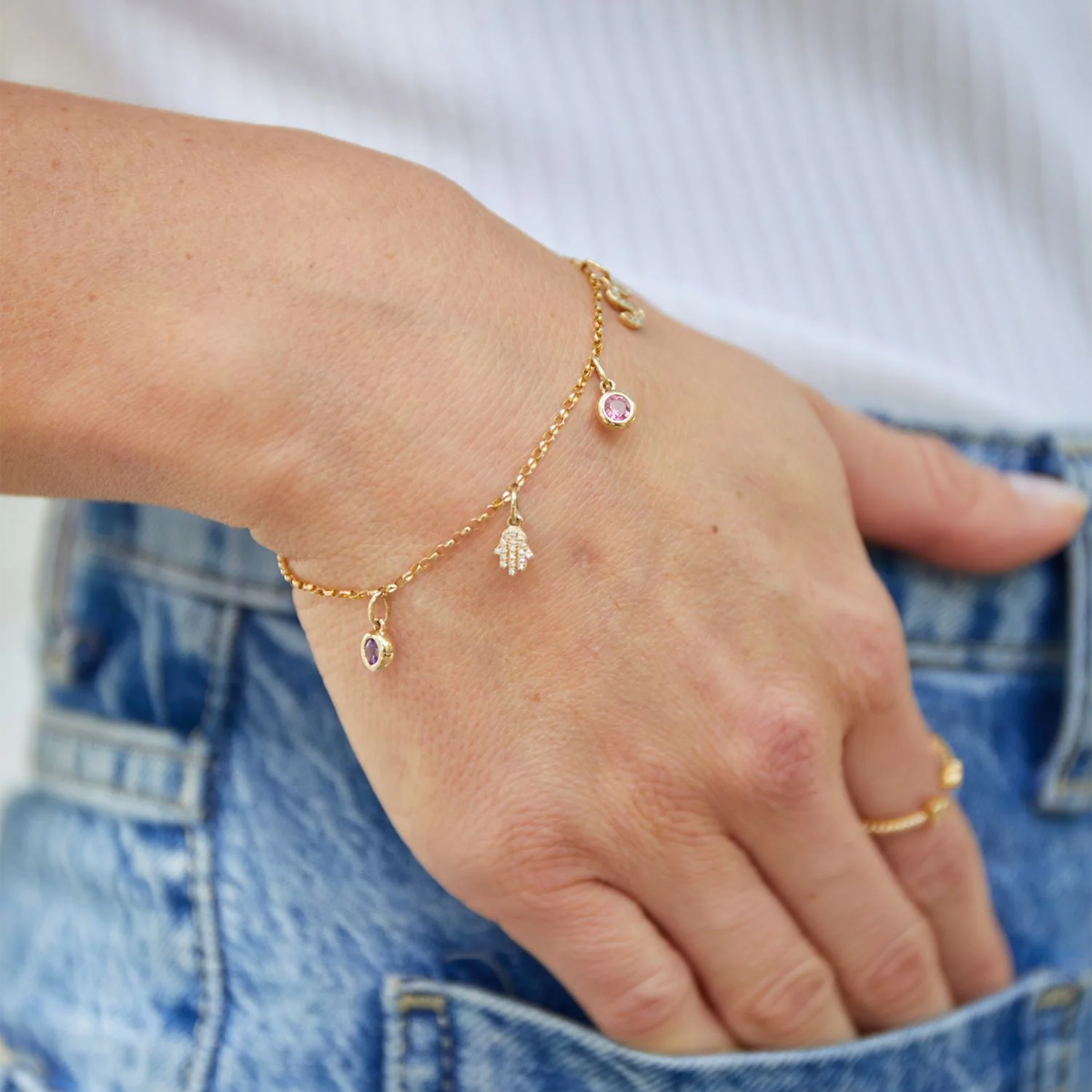 Model wears 9ct Yellow Gold Pink Tourmaline Bezel Set Charm on Bracelet