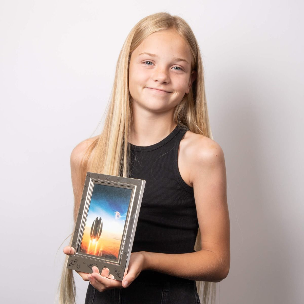 Model holds Silver Plated Space Photo Frame