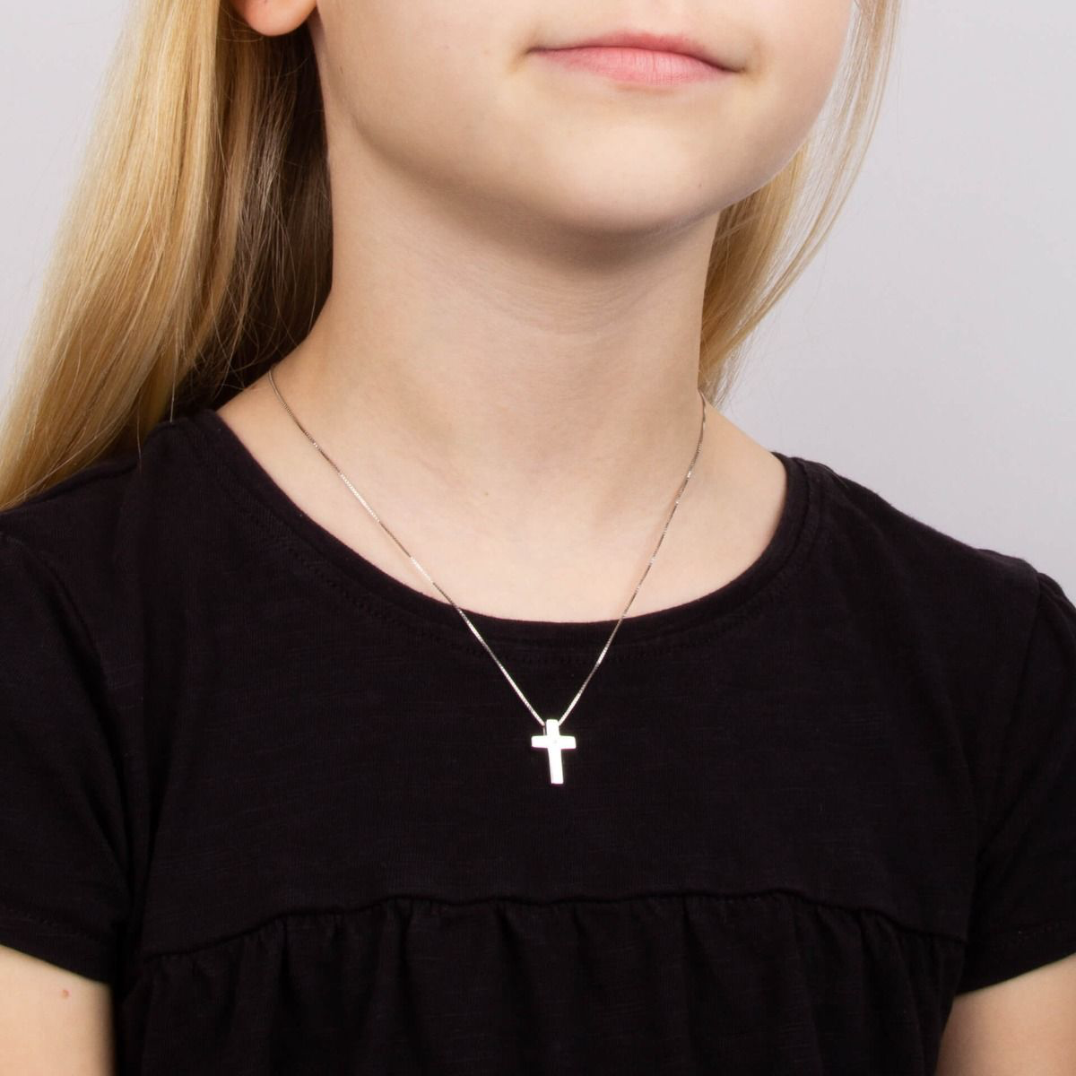 Model wears Sterling Silver Diamond Medium Cross Pendant With Chain