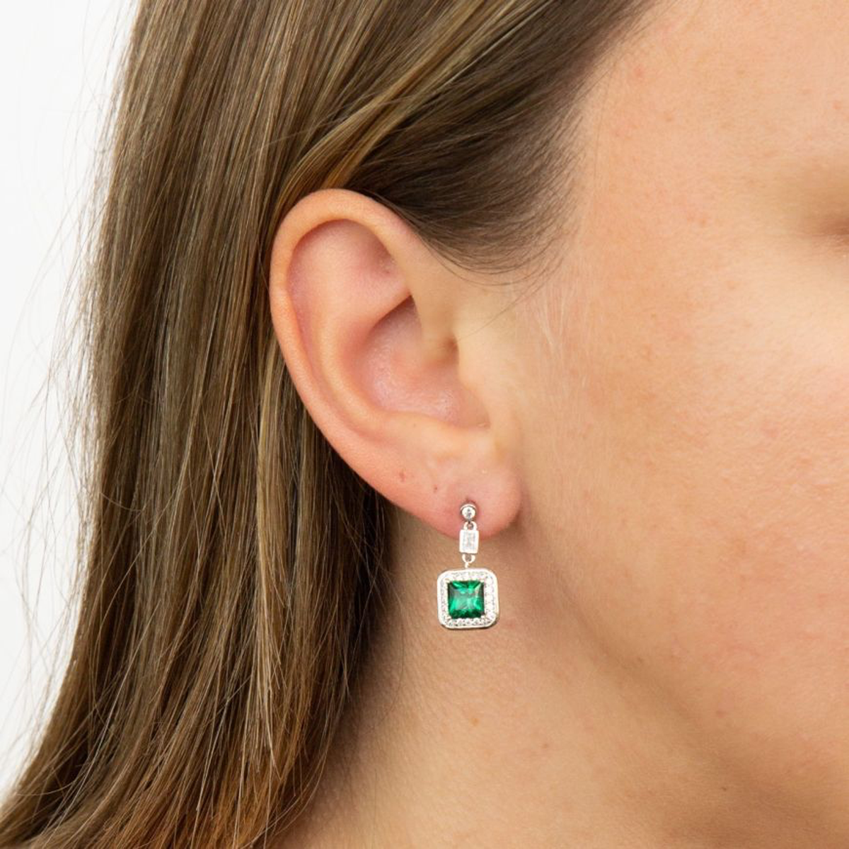 Model wears Sterling Silver Art Deco Style Green Cubic Zirconia Pave Set Drop Earrings