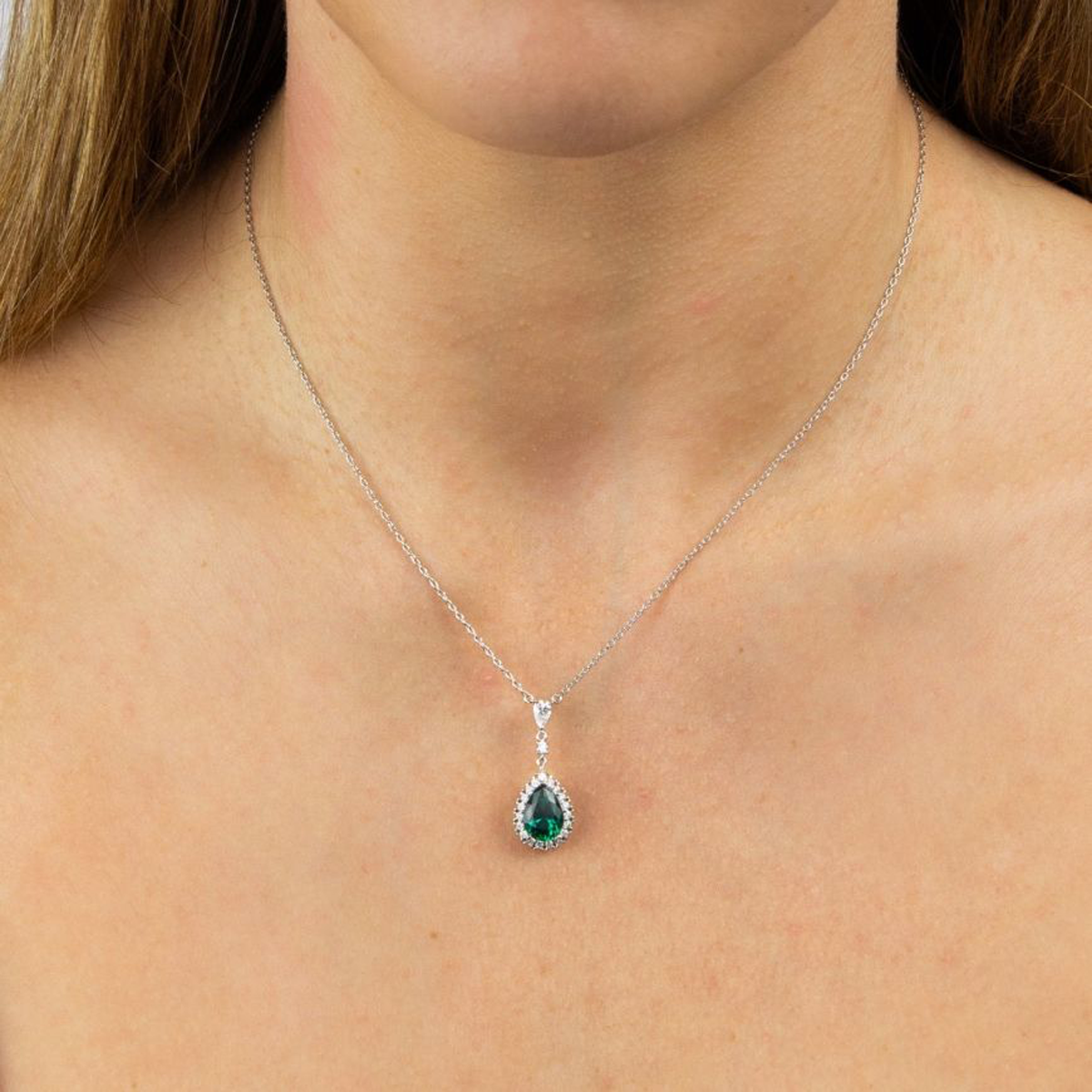 Model wears Sterling Silver Green Cubic Zirconia Teardrop with Pave Surround Necklace