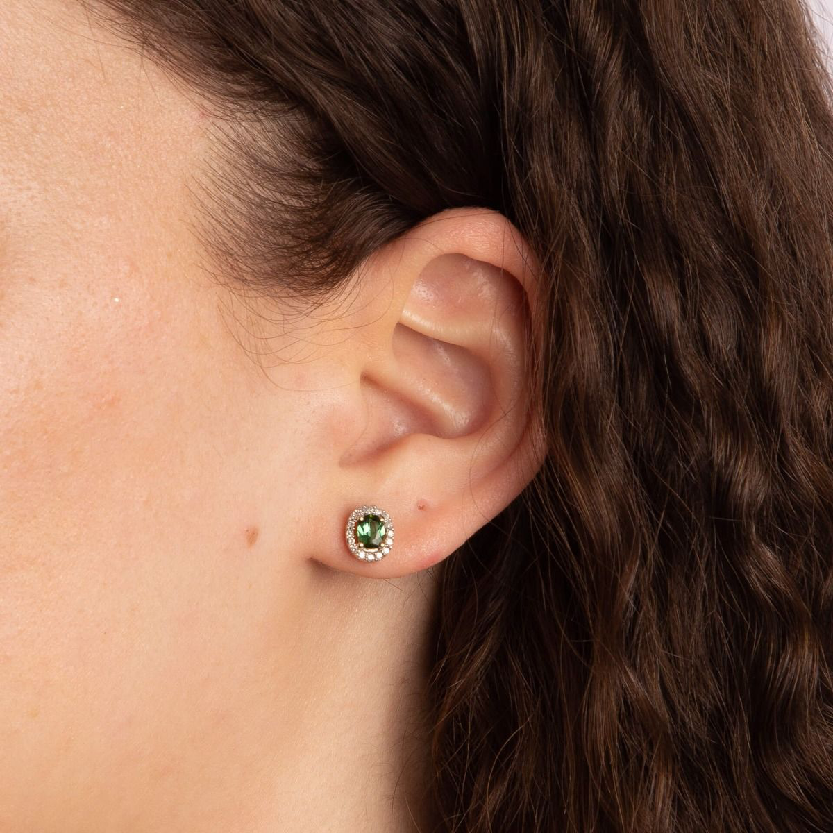 Model wears 9ct Yellow Gold Green Tourmaline & Diamond Halo Stud Earrings