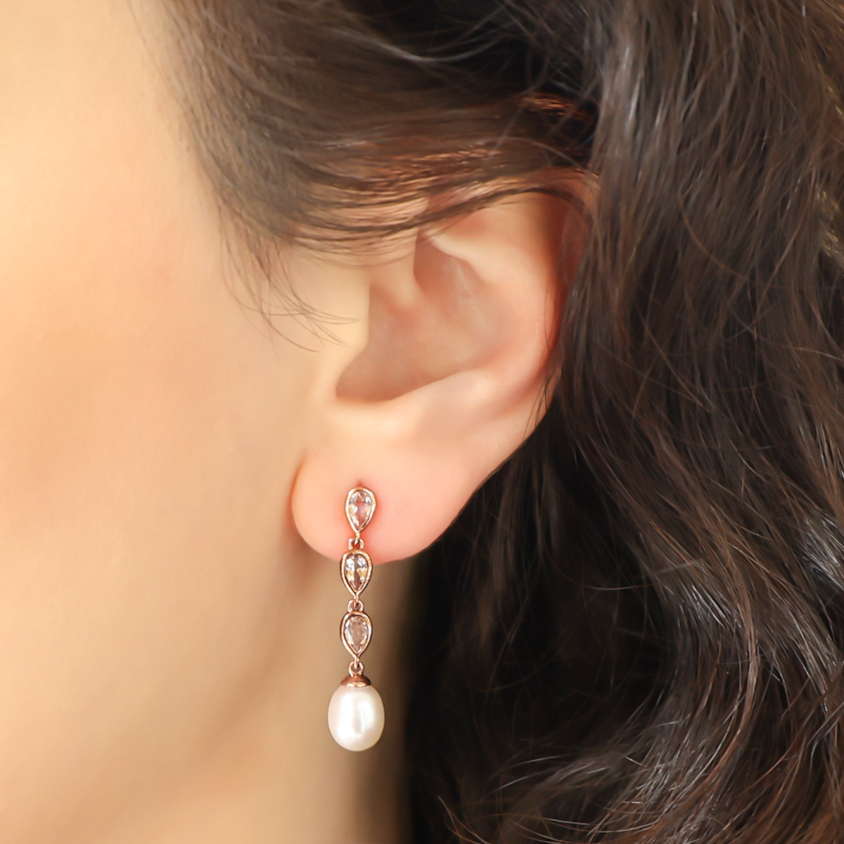 Model wears 9ct Rose Gold Pearl & Morganite Triple Drop Earrings