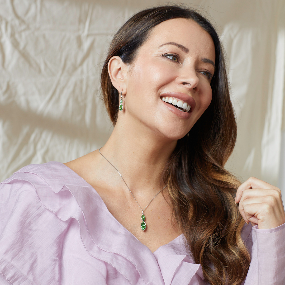 Model wears Sterling Silver Green Crystal Navette Twist Drop Pendant & Chain