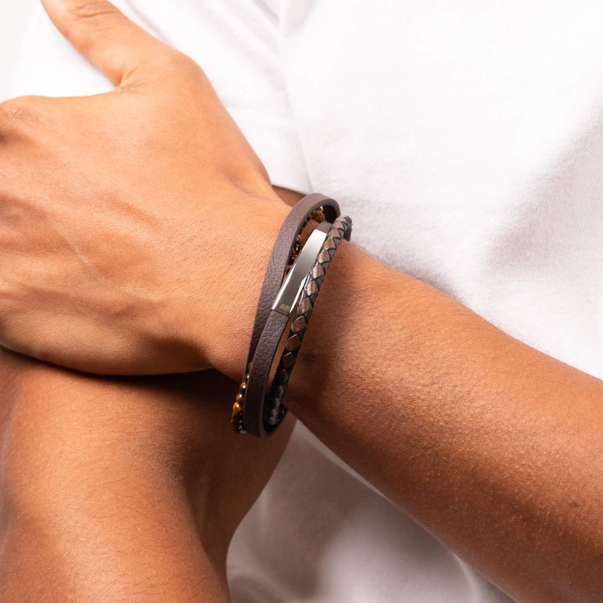Model wears Multi Row Recycled Brown Leather Bracelet With Stainless Steel ID Bar & Tigers Eye Beads