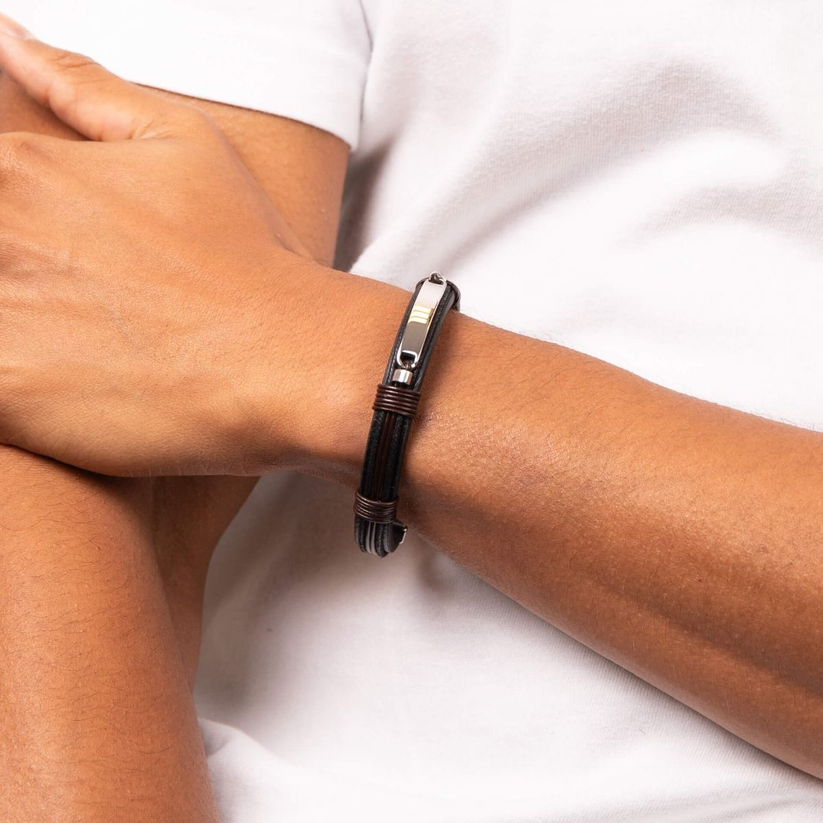 Model wears Stainless Steel ID Bar Black Leather Bracelet With Brown Cord Detail