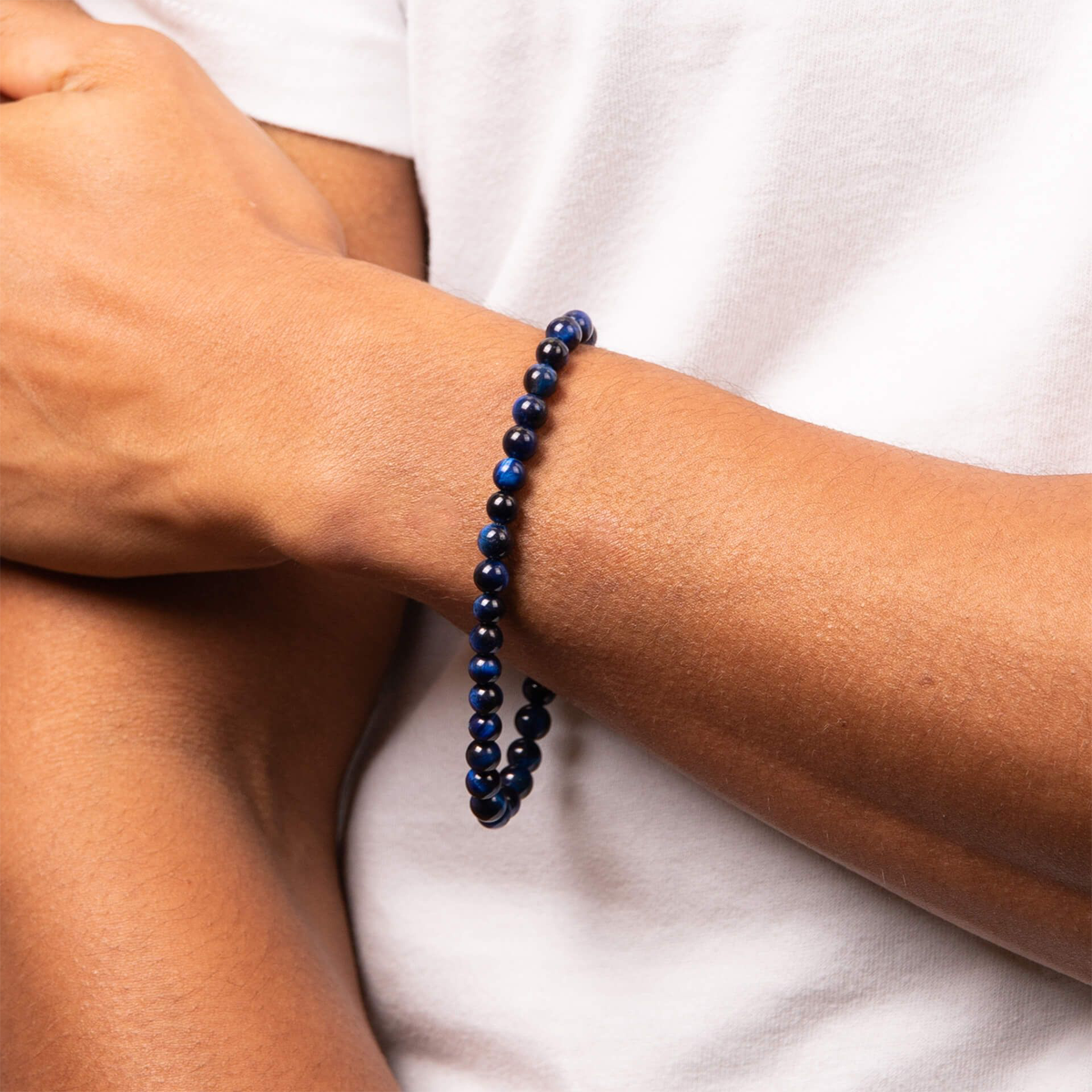 Model wears Stainless Steel Blue Tiger’s Eye Beaded Bracelet