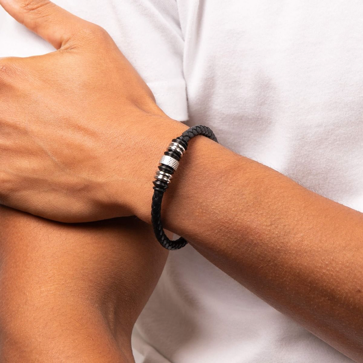 Model wears Stainless Steel Black Leather Disc Bracelet