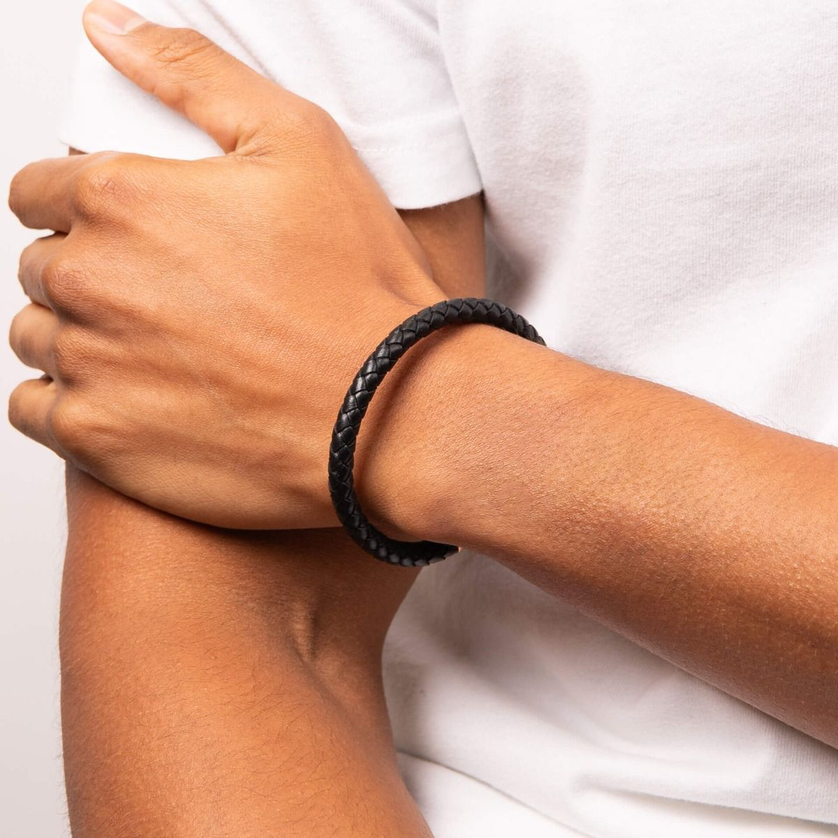 Model wears Black Leather Plait Bracelet with Hexagon Ridge Clasp