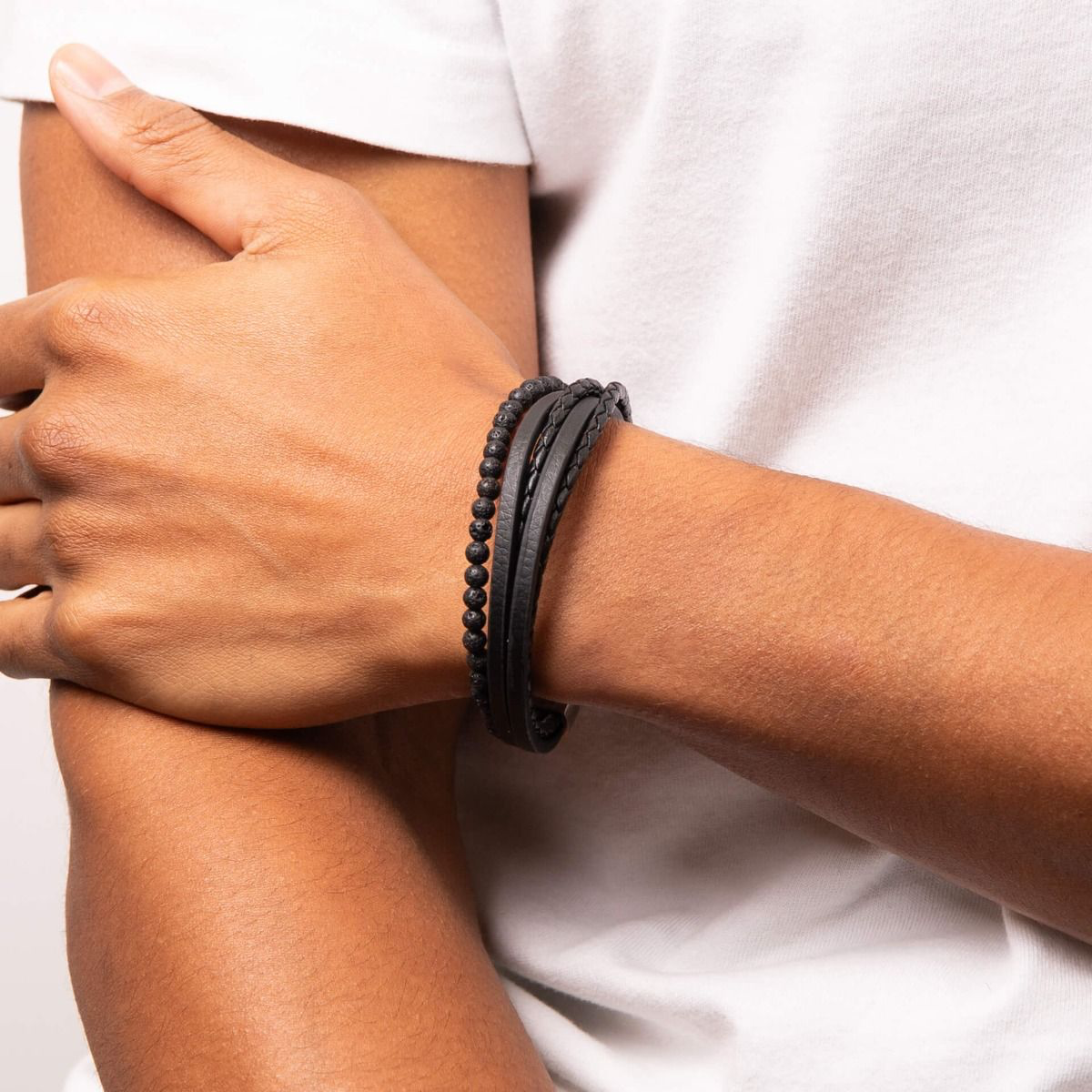 Model wears Multi Row Recycled Black Leather Bracelet with Lava Beads