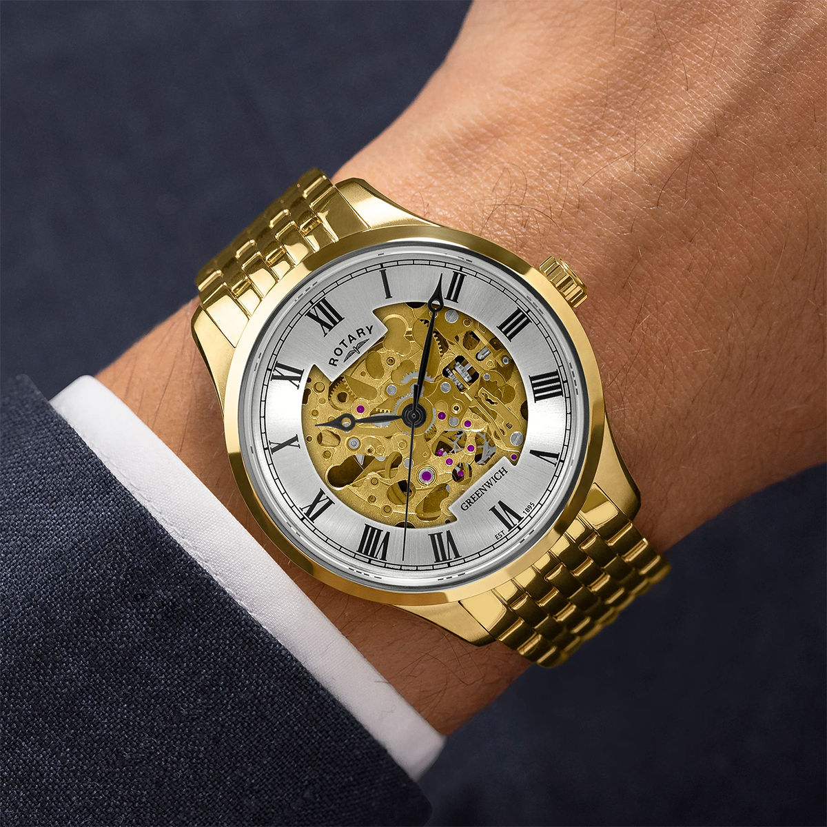 Model wears Rotary Greenwich Skeleton Automatic, Silver Dial with Gold Plated Bracelet - GB02941/03