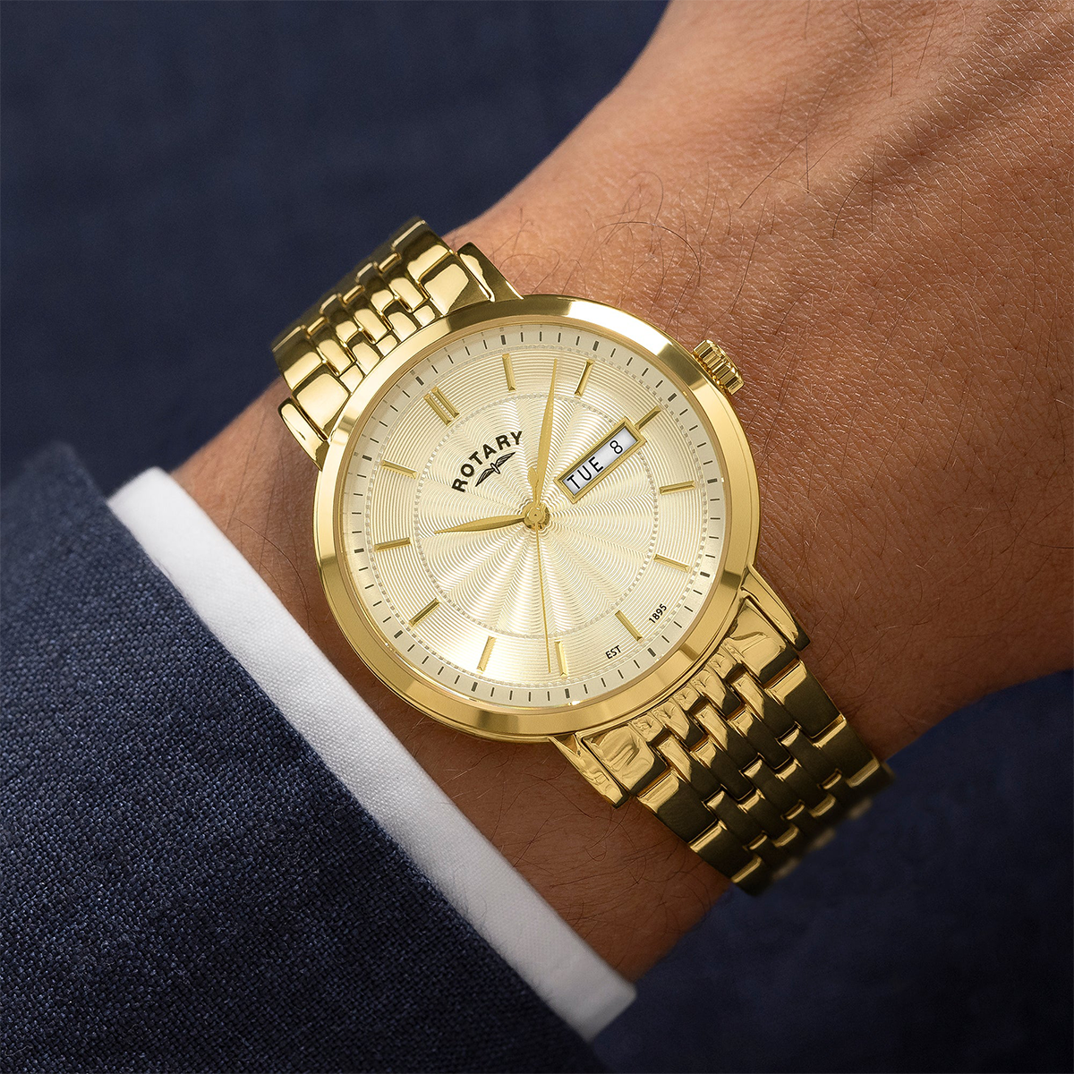 Model wears Rotary Heritage Watch, Champagne Dial with Gold Plated Bracelet GB05423/03