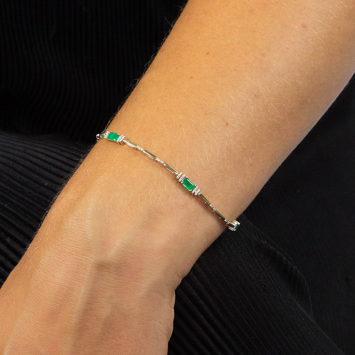 Model wears 9ct Yellow Gold Emerald & Diamond Log Bracelet
