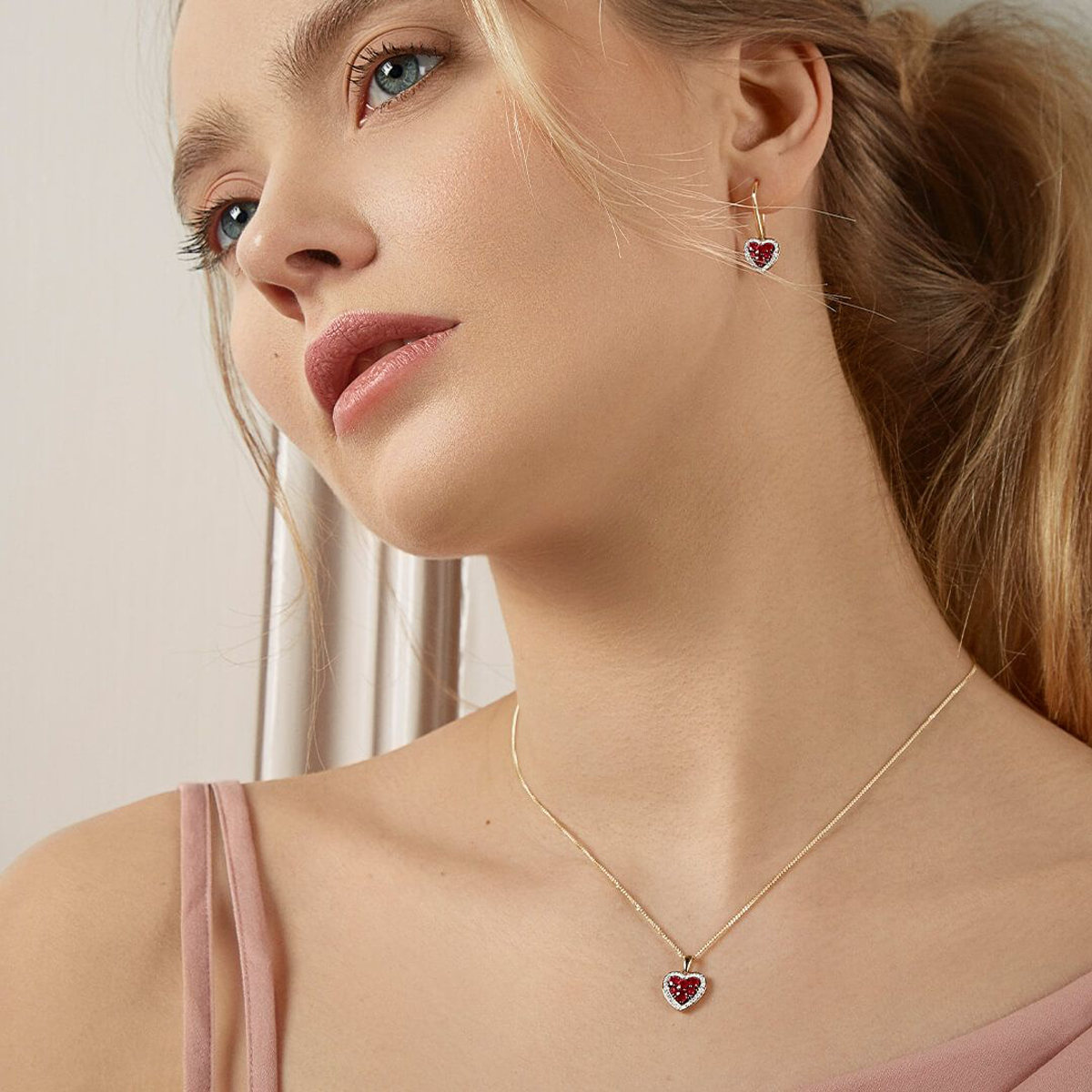 Model wears 9ct Yellow Gold Ruby & Diamond Set Heart Pendant