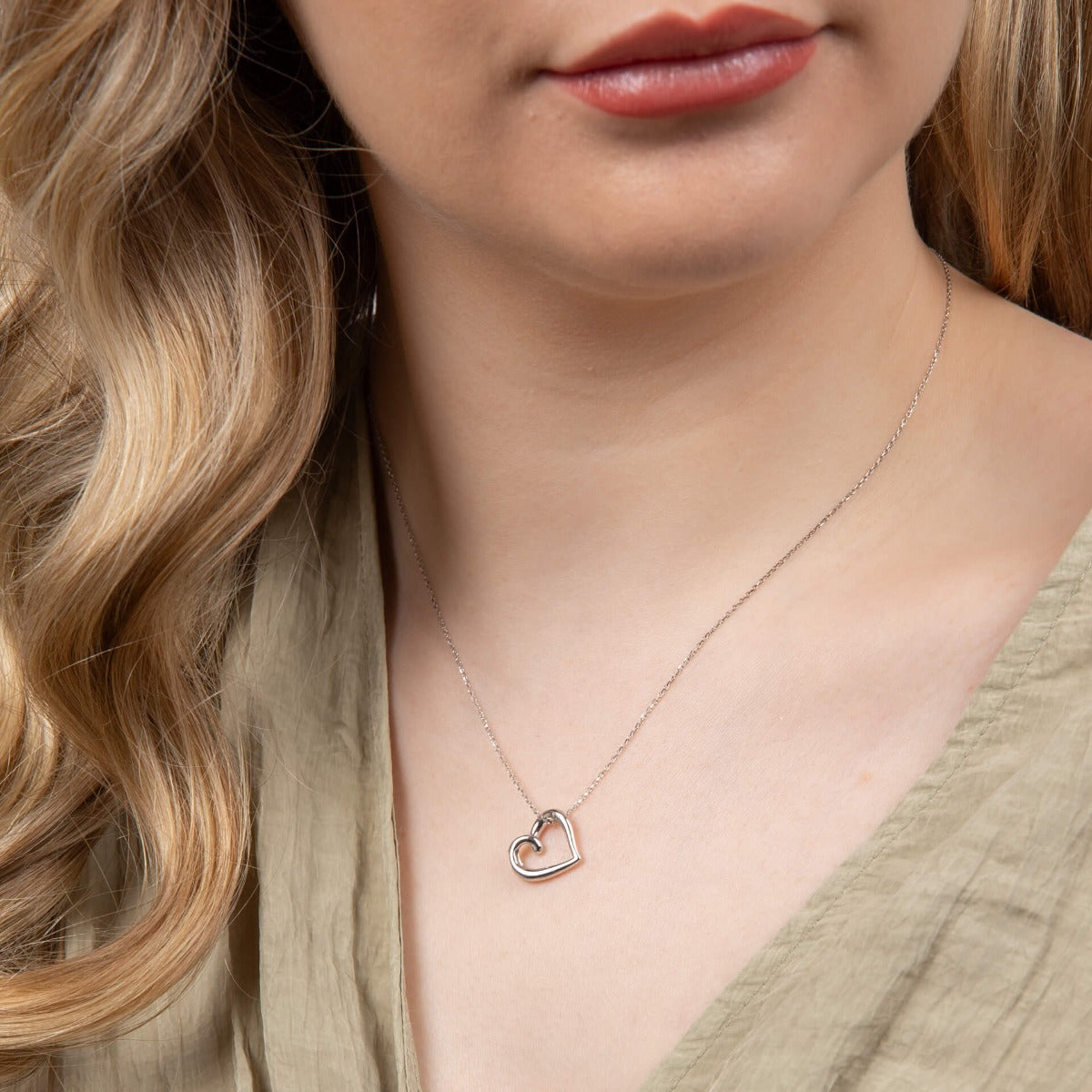 Model wears 9ct White Gold Organic Heart Pendant