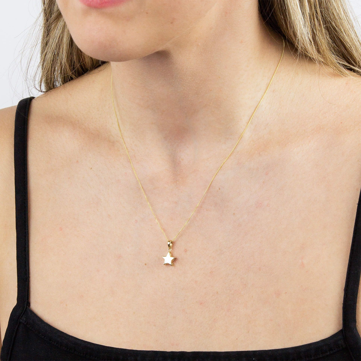 Model wears 9ct Yellow Gold Star Pendant