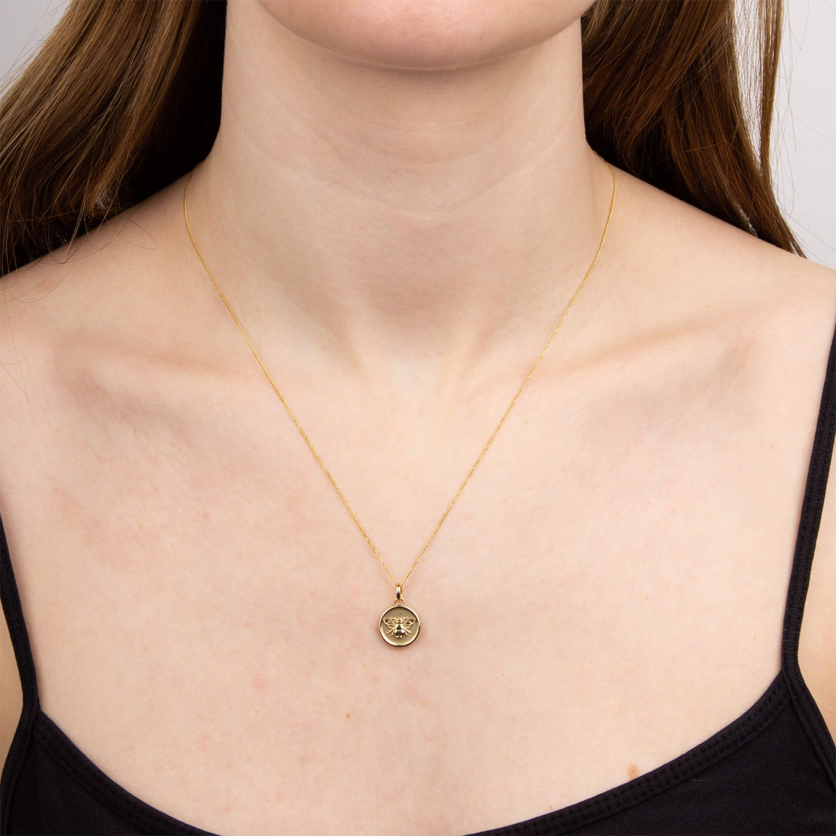 Model wears 9ct Yellow Gold Bee Medallion Pendant