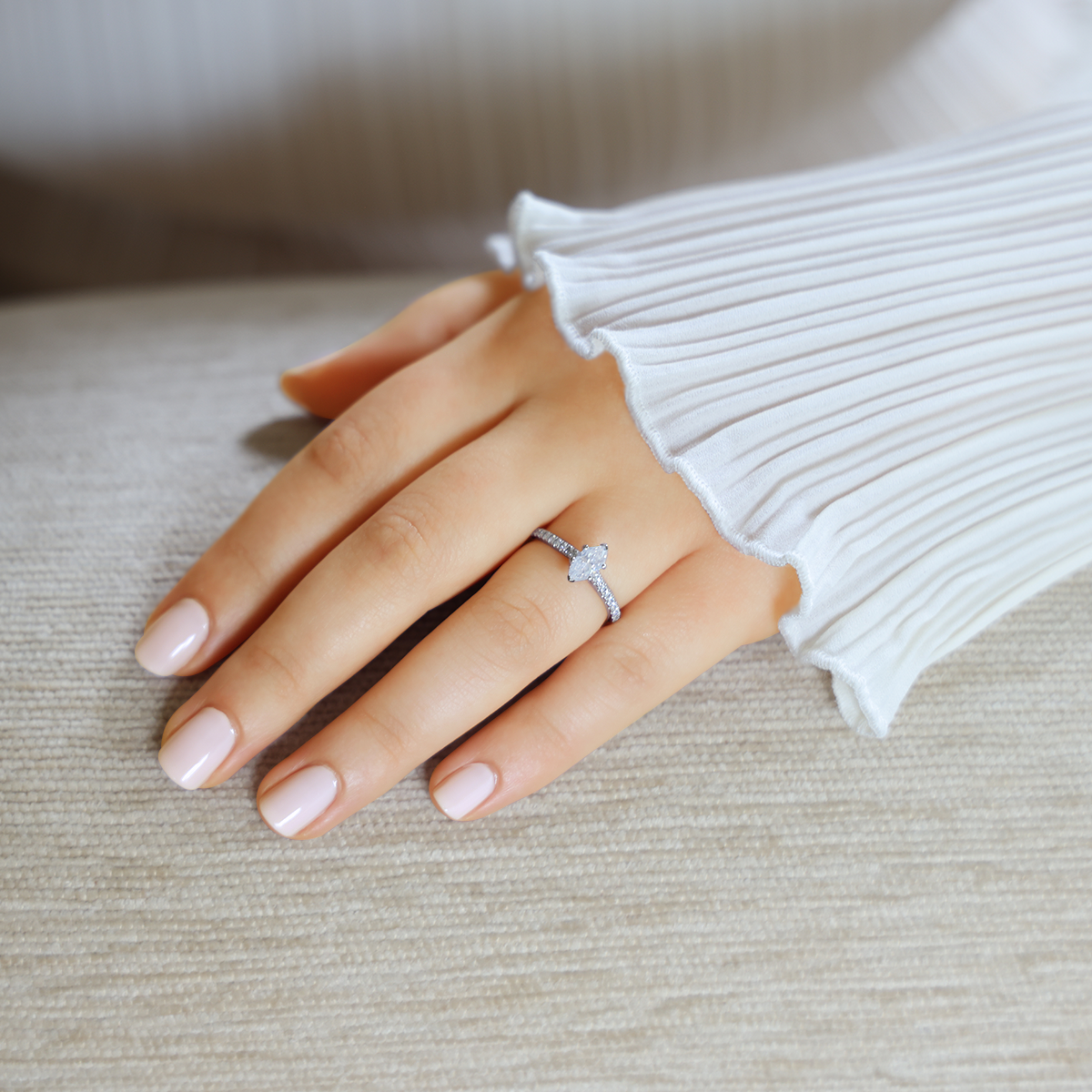 Model wears Platinum Marquise Cut Diamond Solitaire & Shoulder 0.91ctw Ring