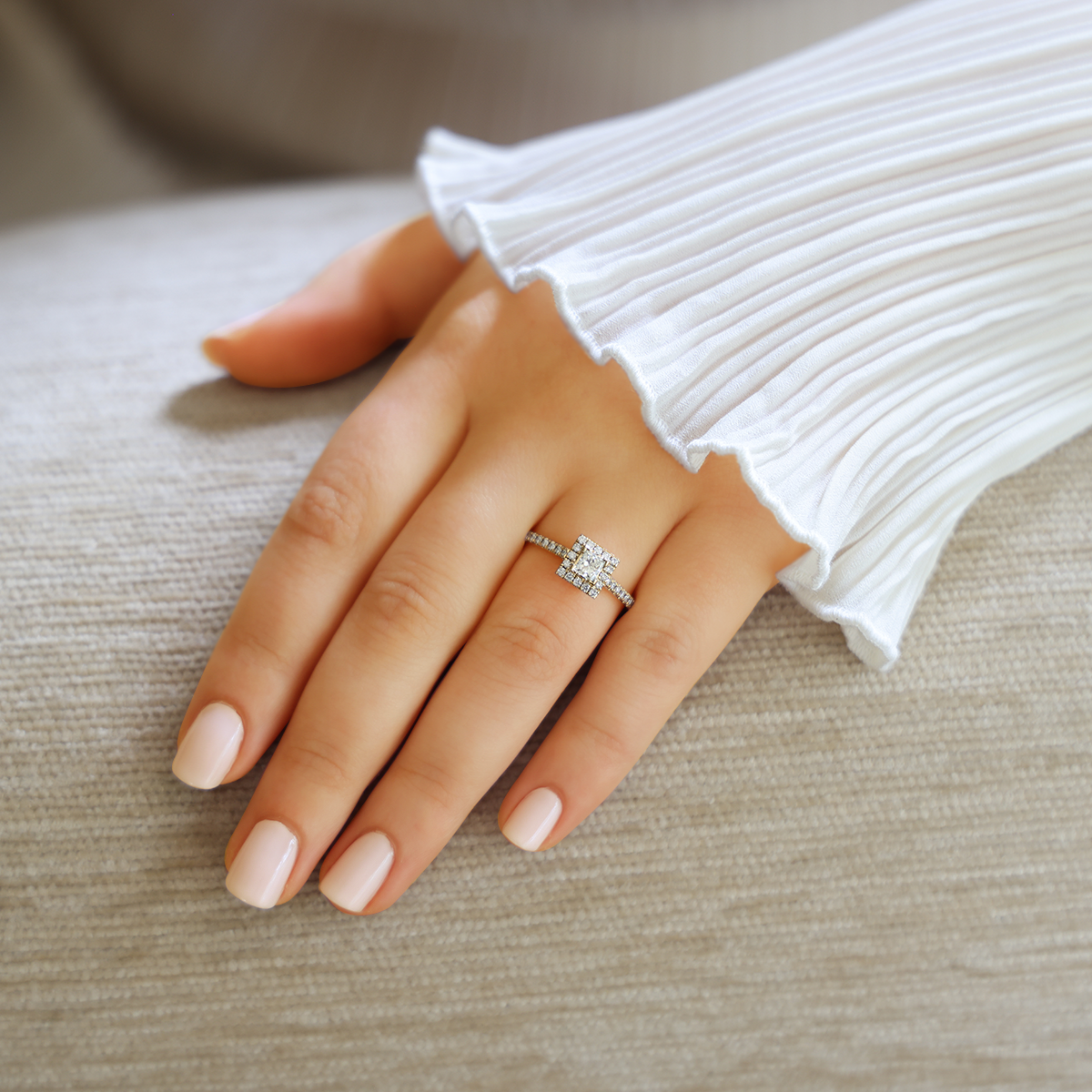 Model wears 18ct Yellow Gold Princess Shaped Diamond Halo & Shoulder 0.63ctw Ring