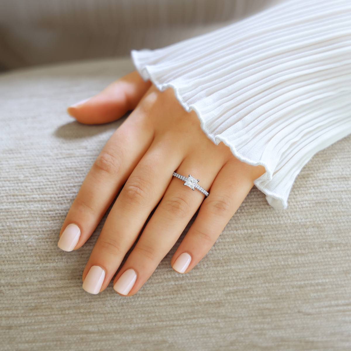 Model wears Platinum Princess Cut Diamond Solitaire & Shoulder 0.86ctw Ring