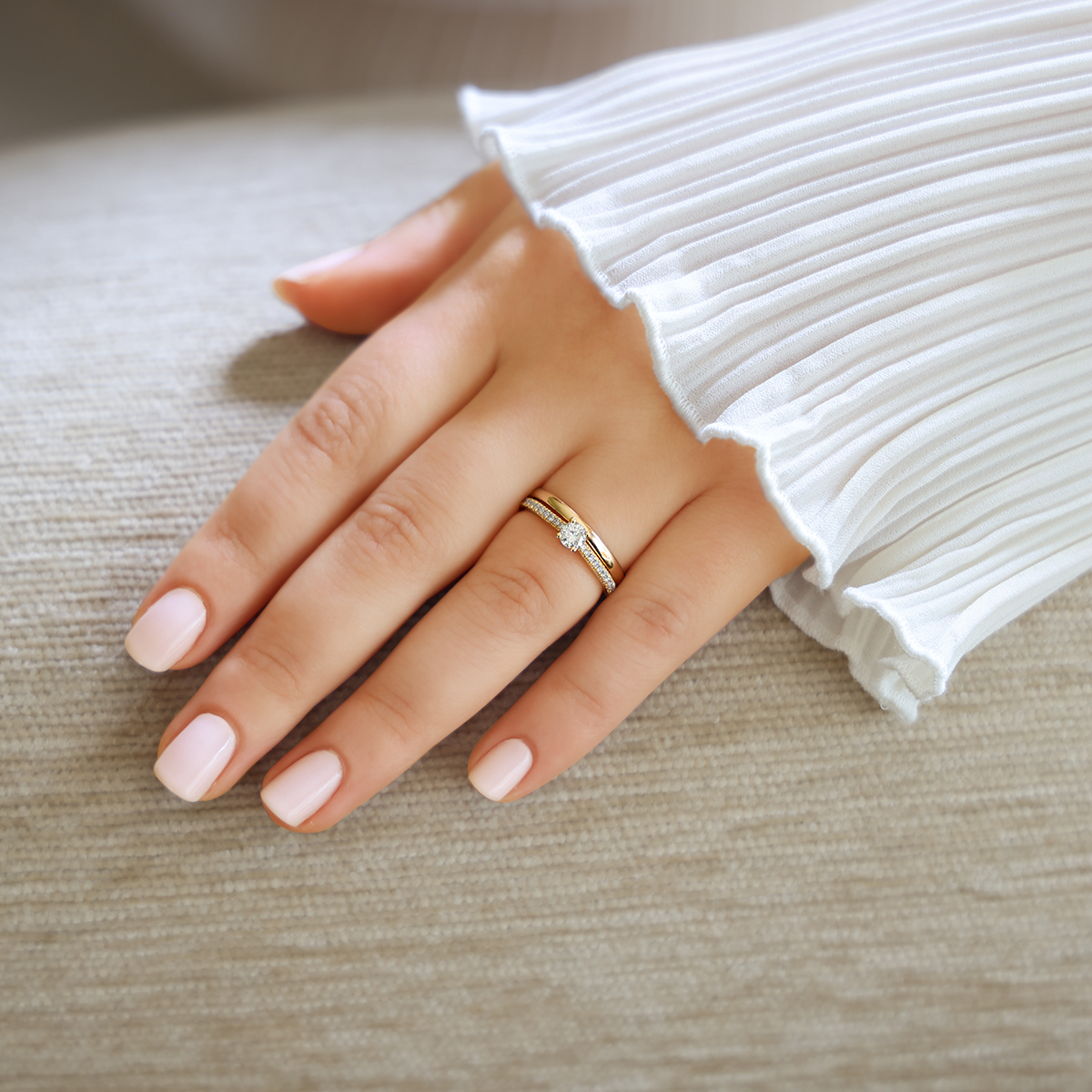 Model wears 18ct Yellow Gold Round Brilliant Cut Diamond Solitaire & Shoulder 0.47ctw Ring with Wedding Band