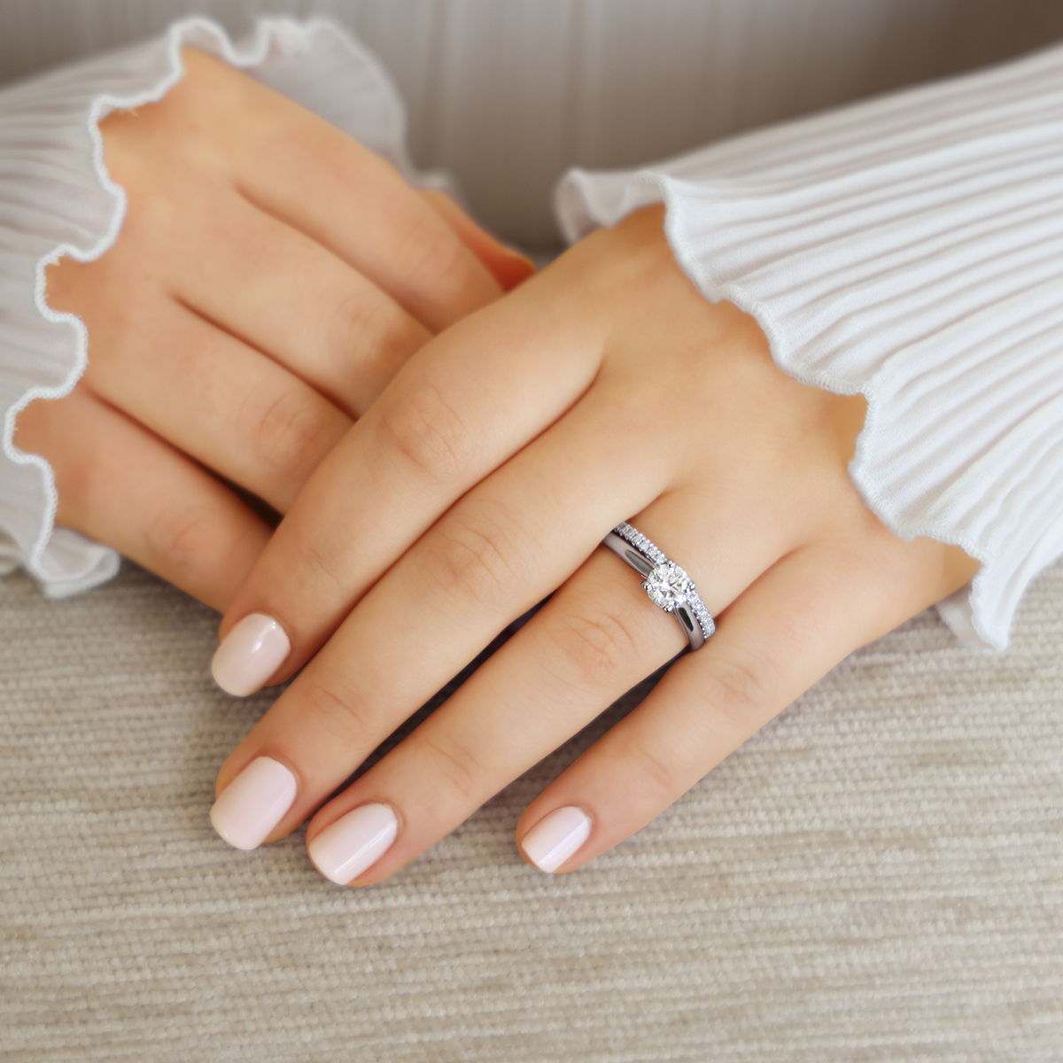 Model wears Platinum Round Brilliant Cut Diamond Solitaire 1.00ct Ring with Matching Eternity Ring