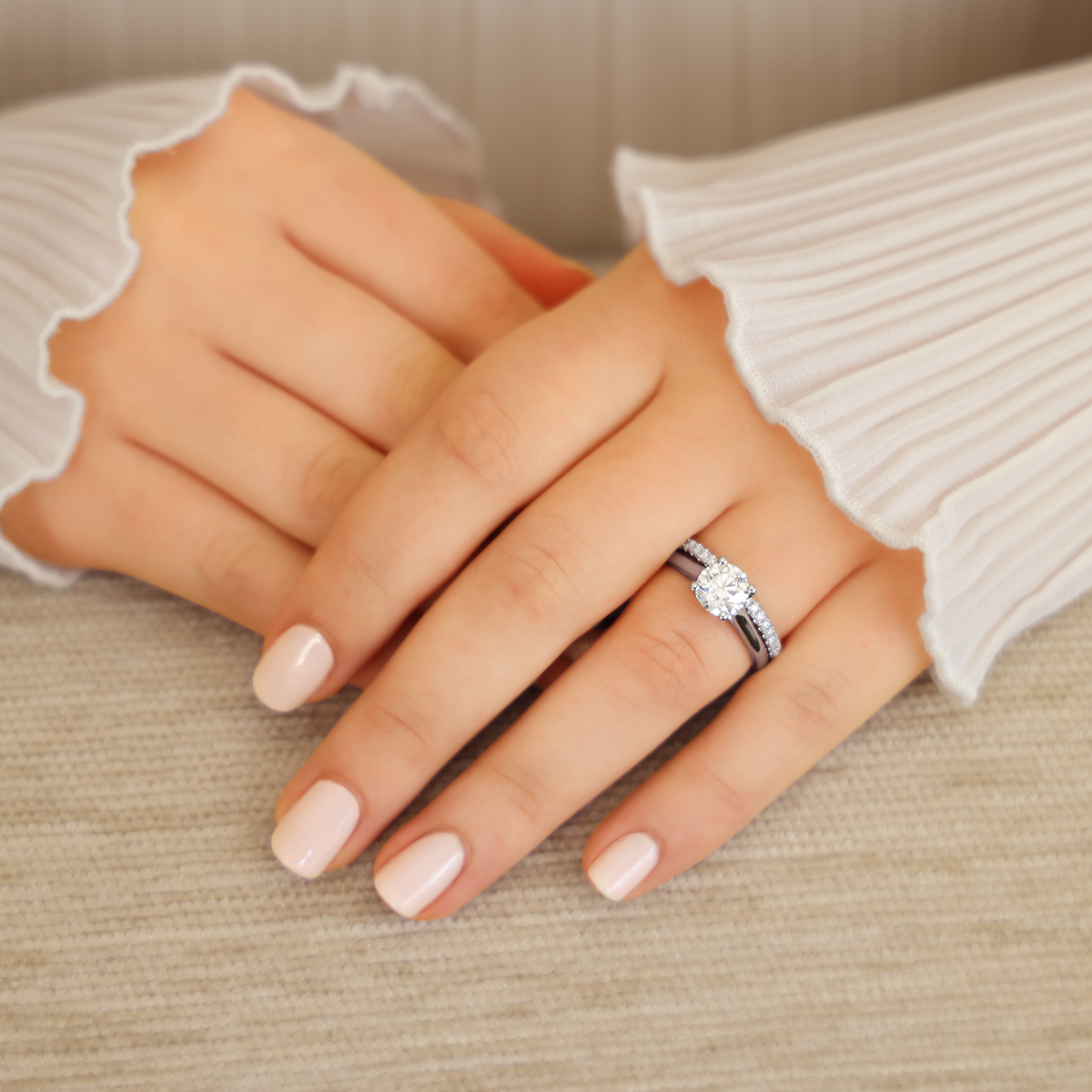 Model wears Platinum Round Brilliant Cut Diamond Solitaire 1.50ct Ring with Matching Eternity Ring