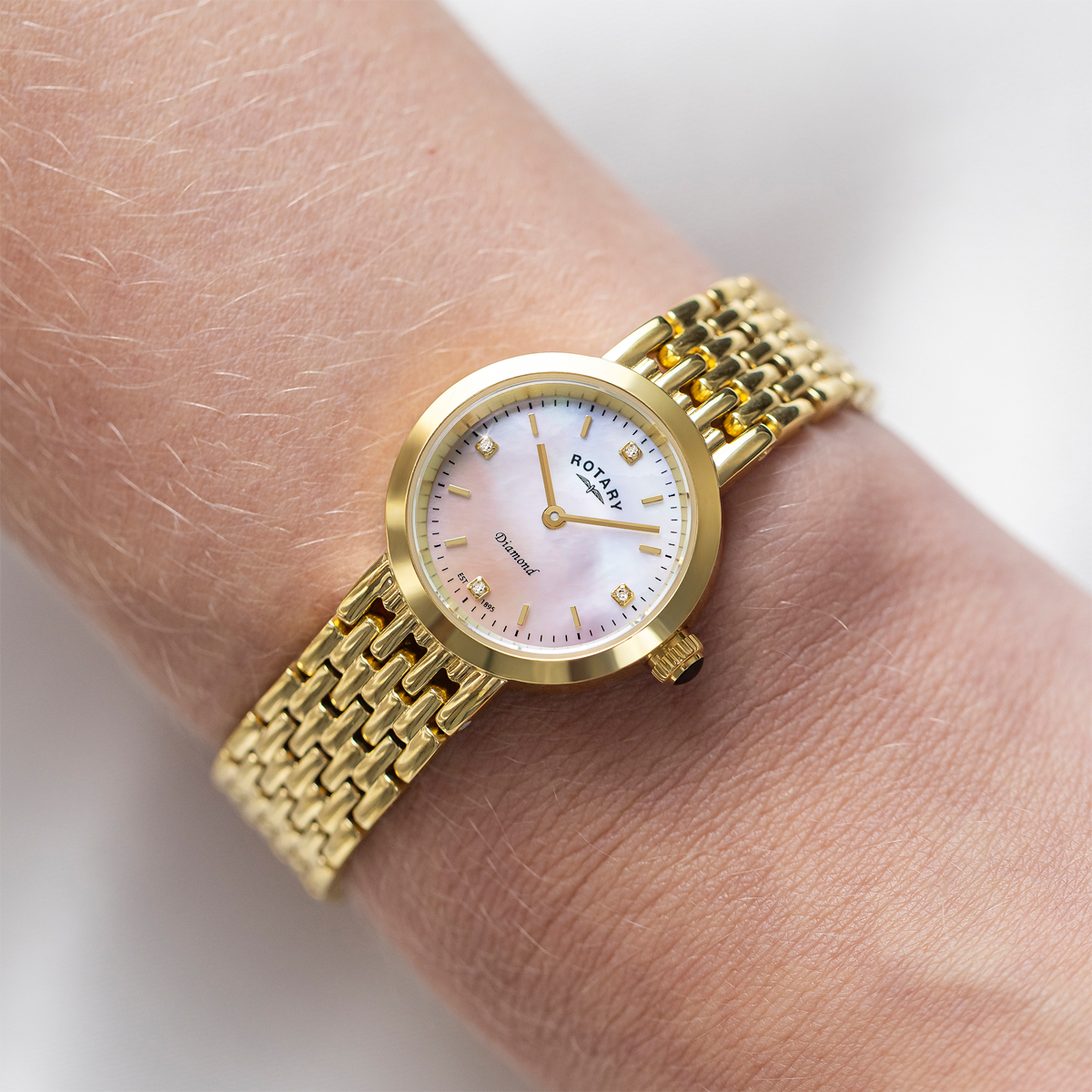 Model wears Rotary Heritage Diamond Set, Mother of Pearl Dial with Gold Plated Bracelet - LB00900/41/D