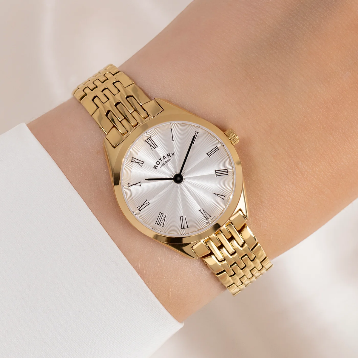 Model wears Rotary Ultra Slim Ladies, Silver Dial with Gold Plated Bracelet - LB08013/01