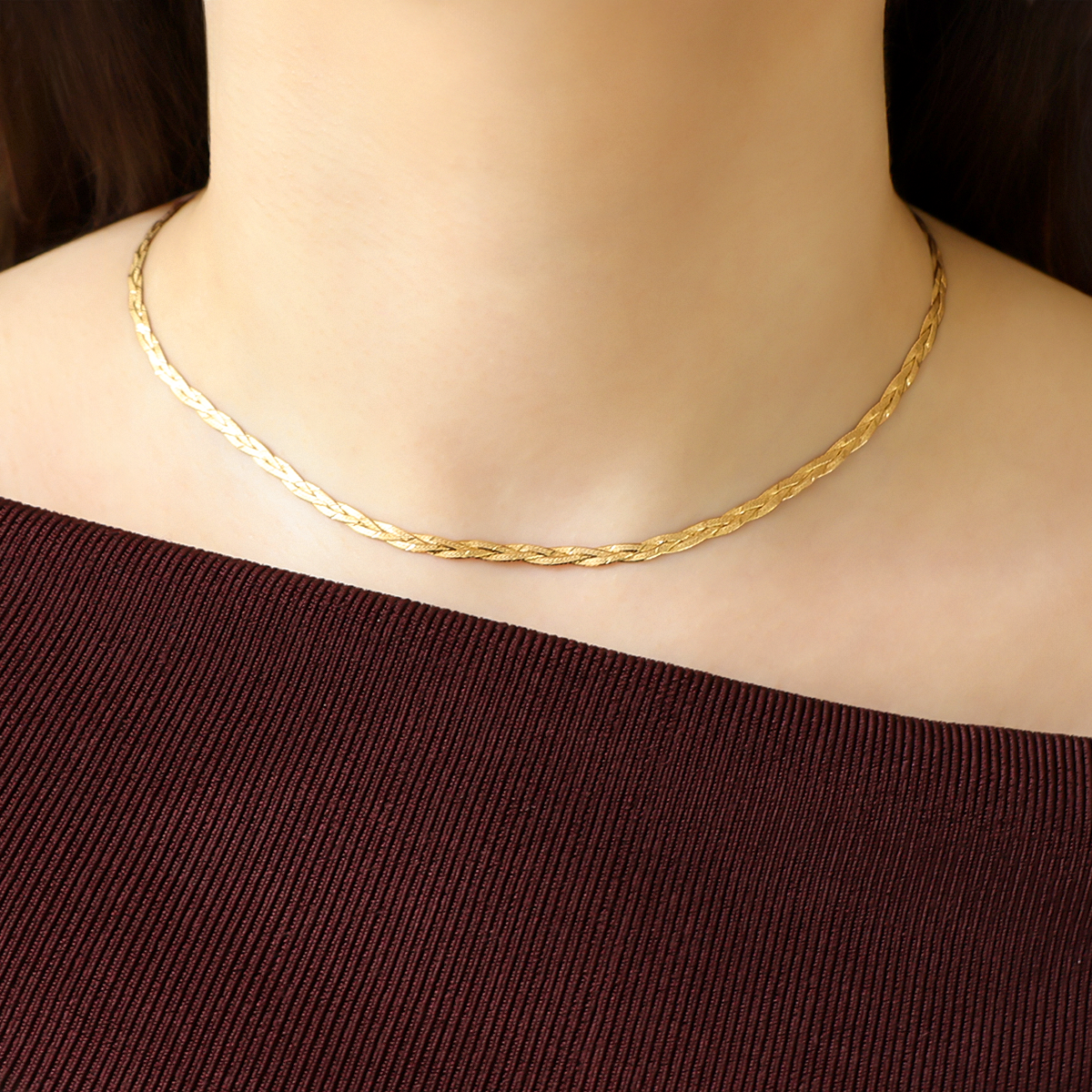 Model wears 9ct Yellow Gold Diamond Cut Herringbone Plait Necklace