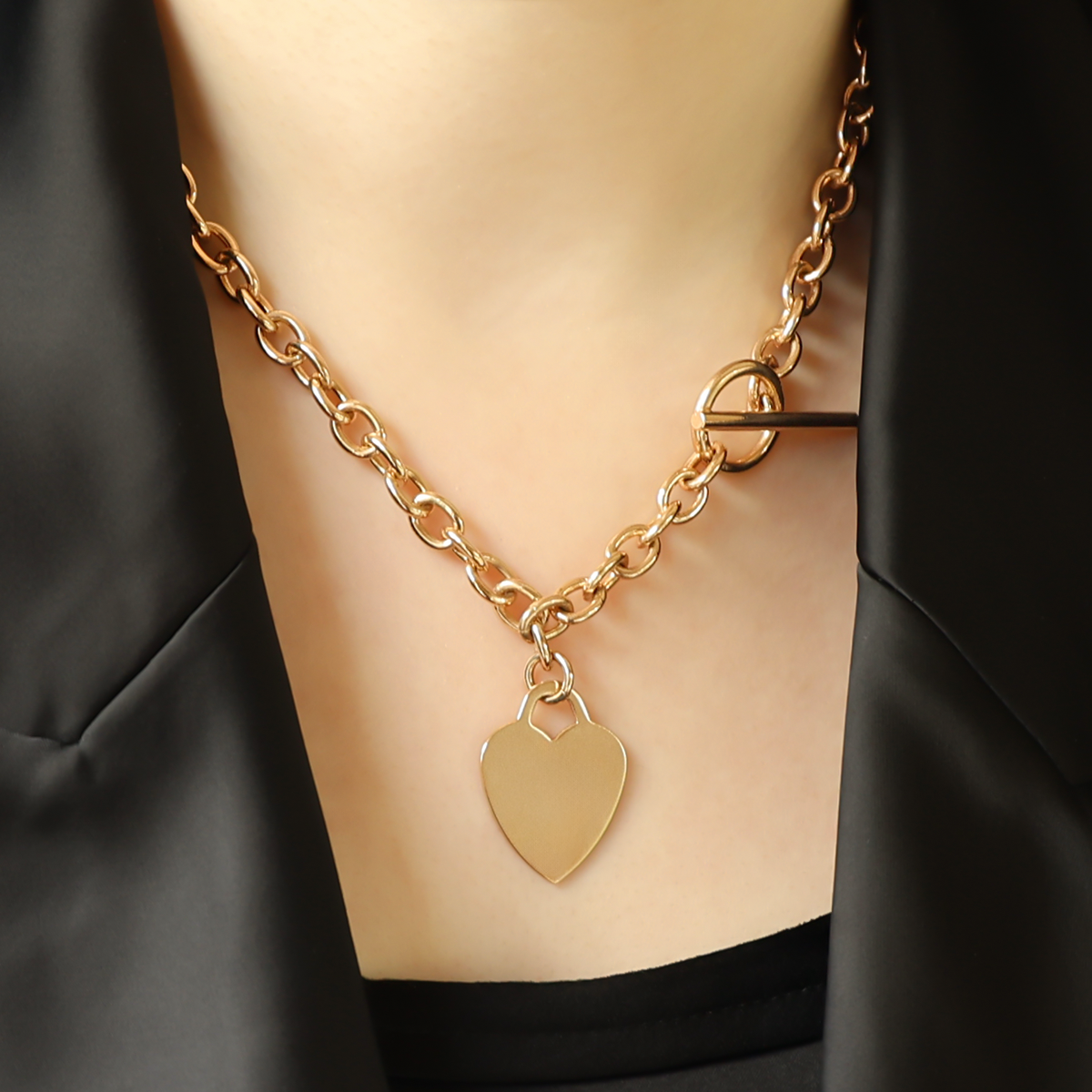 Model wears 9ct Yellow Gold 17.5” Solid Oval Belcher Heart Tag T-Bar Necklace