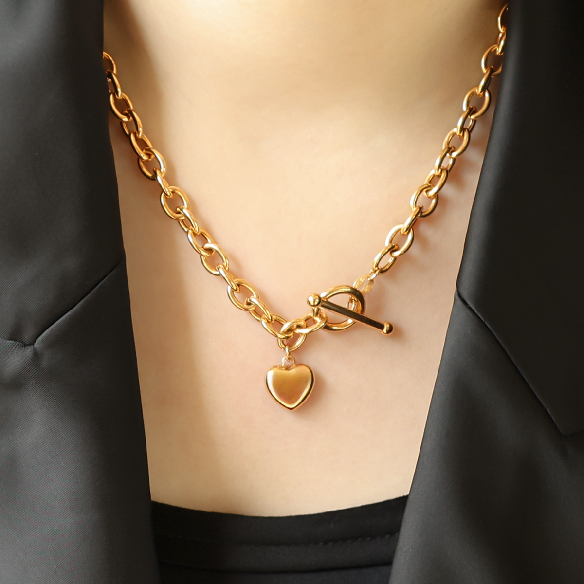 Model wears 9ct Yellow Gold 17” Oval Belcher Heart Charm T-Bar Necklace