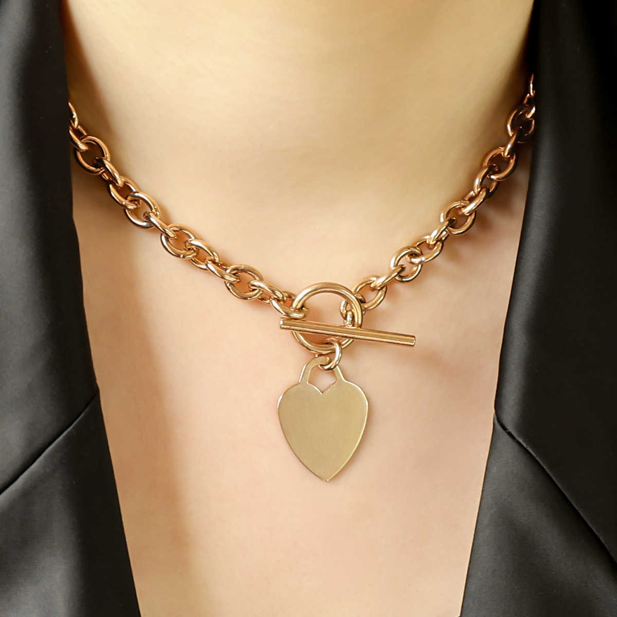 Model wears 9ct Yellow Gold 15.5” Solid Oval Belcher Heart Tag T-Bar Necklace