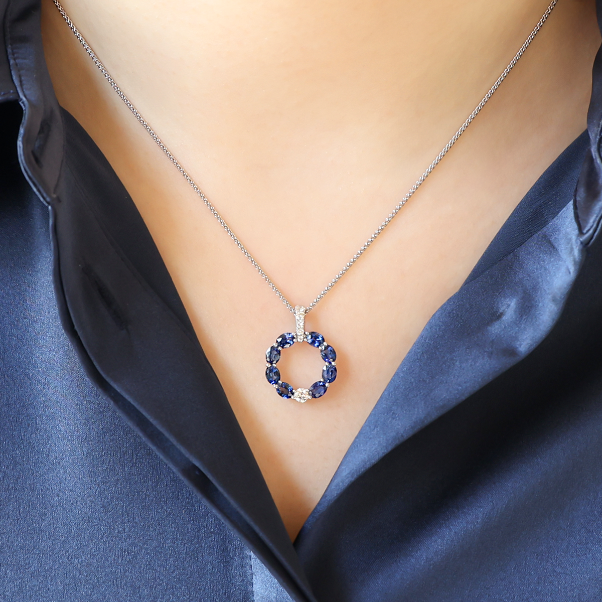 Model wears 18ct White Gold Sapphire & Diamond Circle Pendant & Chain