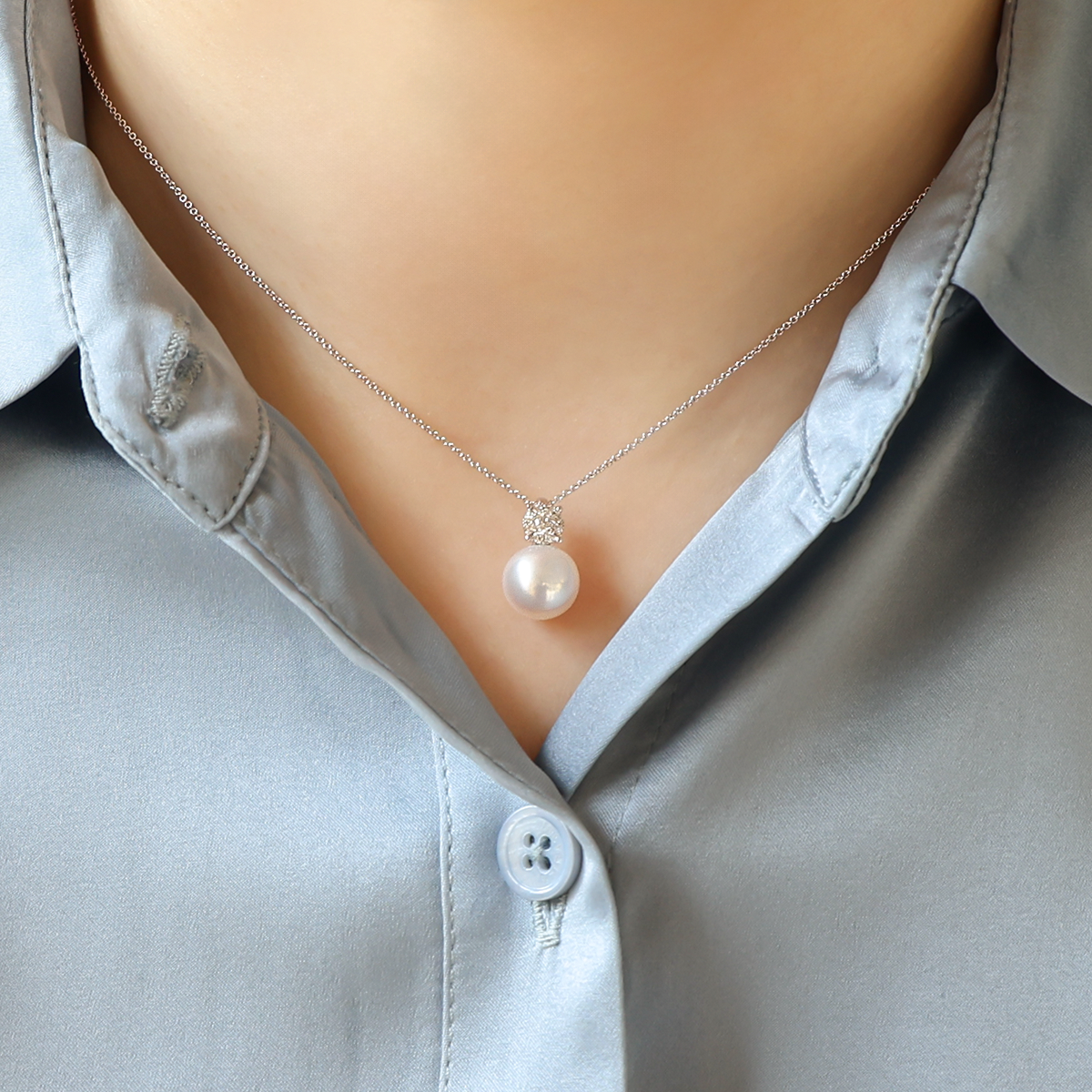 Model wears 9ct White Gold Cultured Freshwater Pearl & Diamond Pendant With Chain