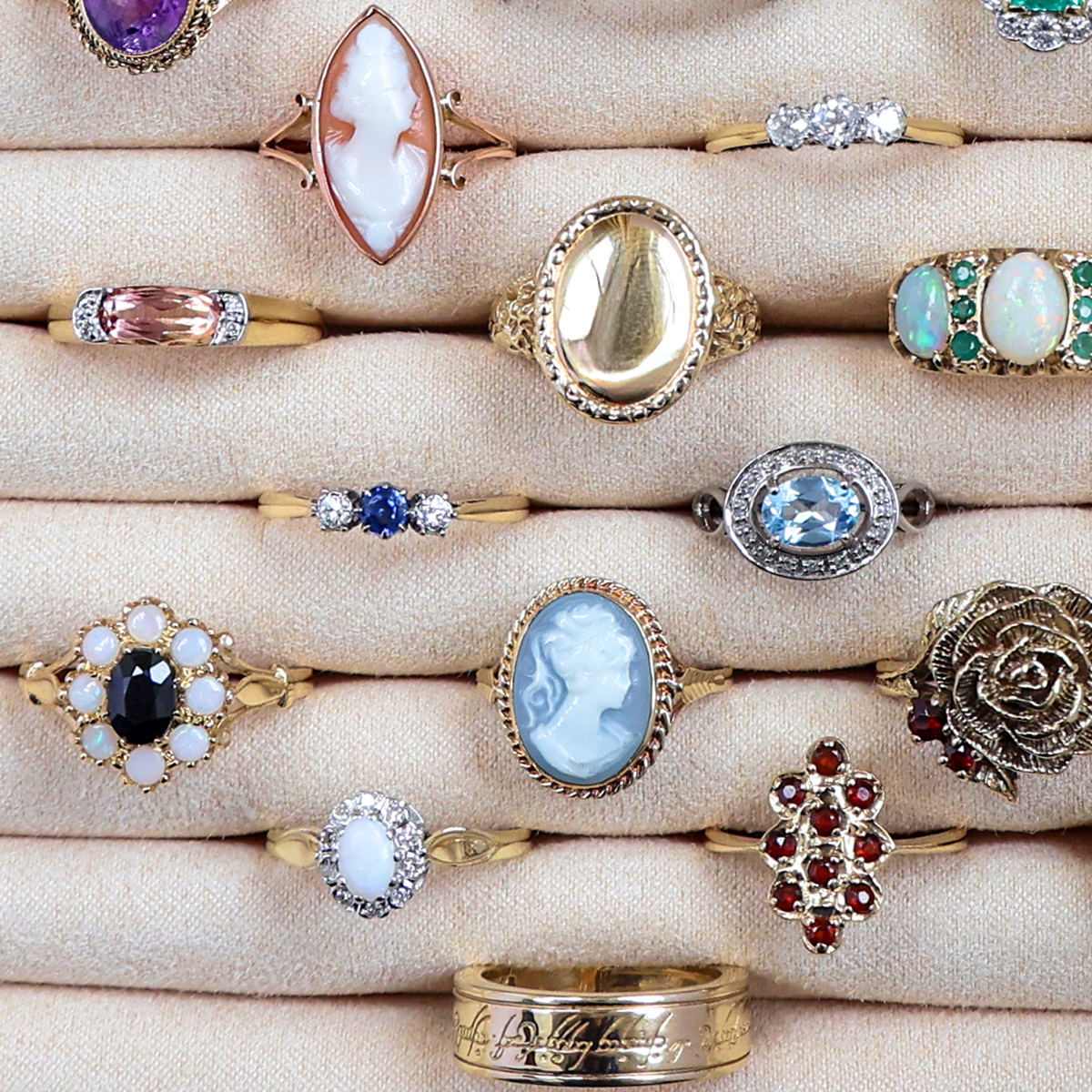 A selection of Estate, Vintage or Antique gold rings set with precious gemstones and crafted with intricate motifs.