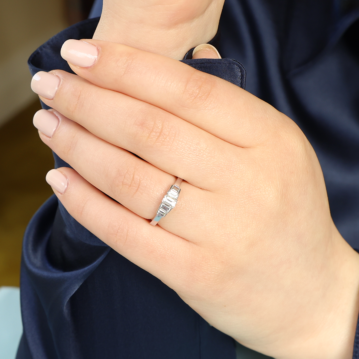 Model wears 18ct White Gold 0.75cts Emerald Cut Diamond Five Stone Ring