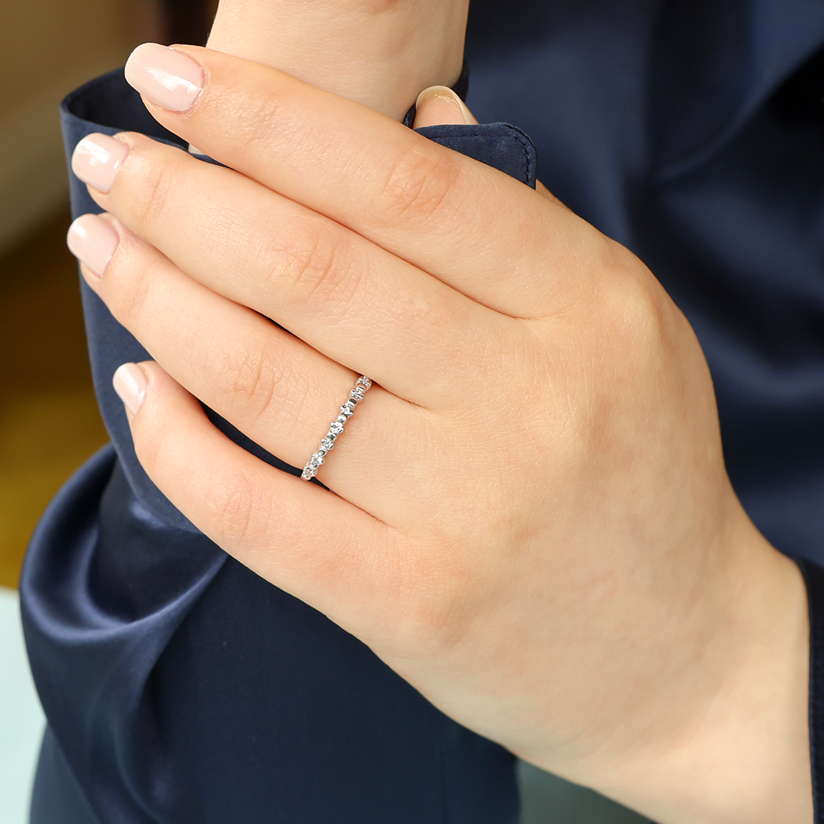 Model wears Platinum Round Brilliant Cut 0.10cts Diamond Beaded Ring