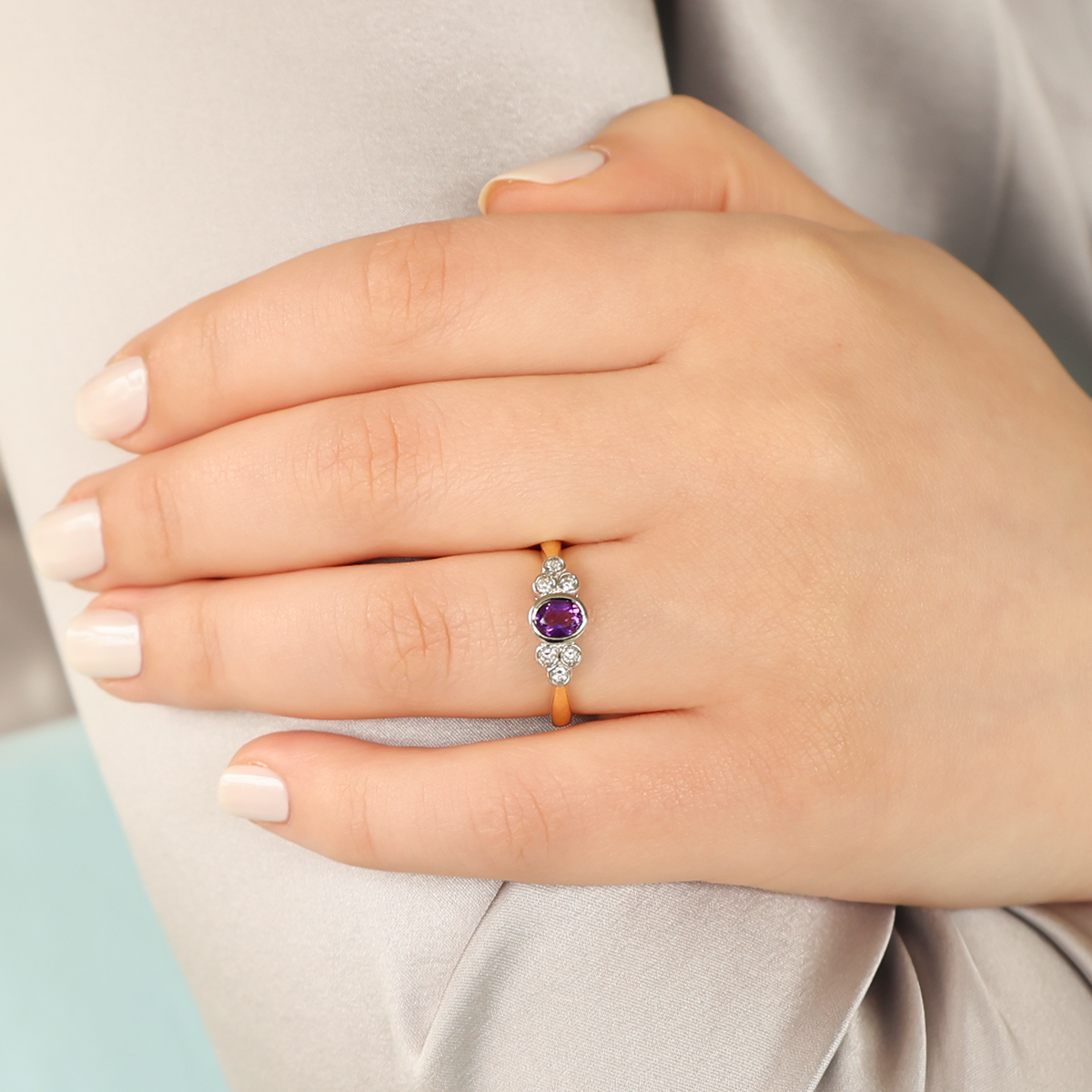 Model wears 18ct Yellow Gold Amethyst & Diamond Bezel Set Seven Stone Ring