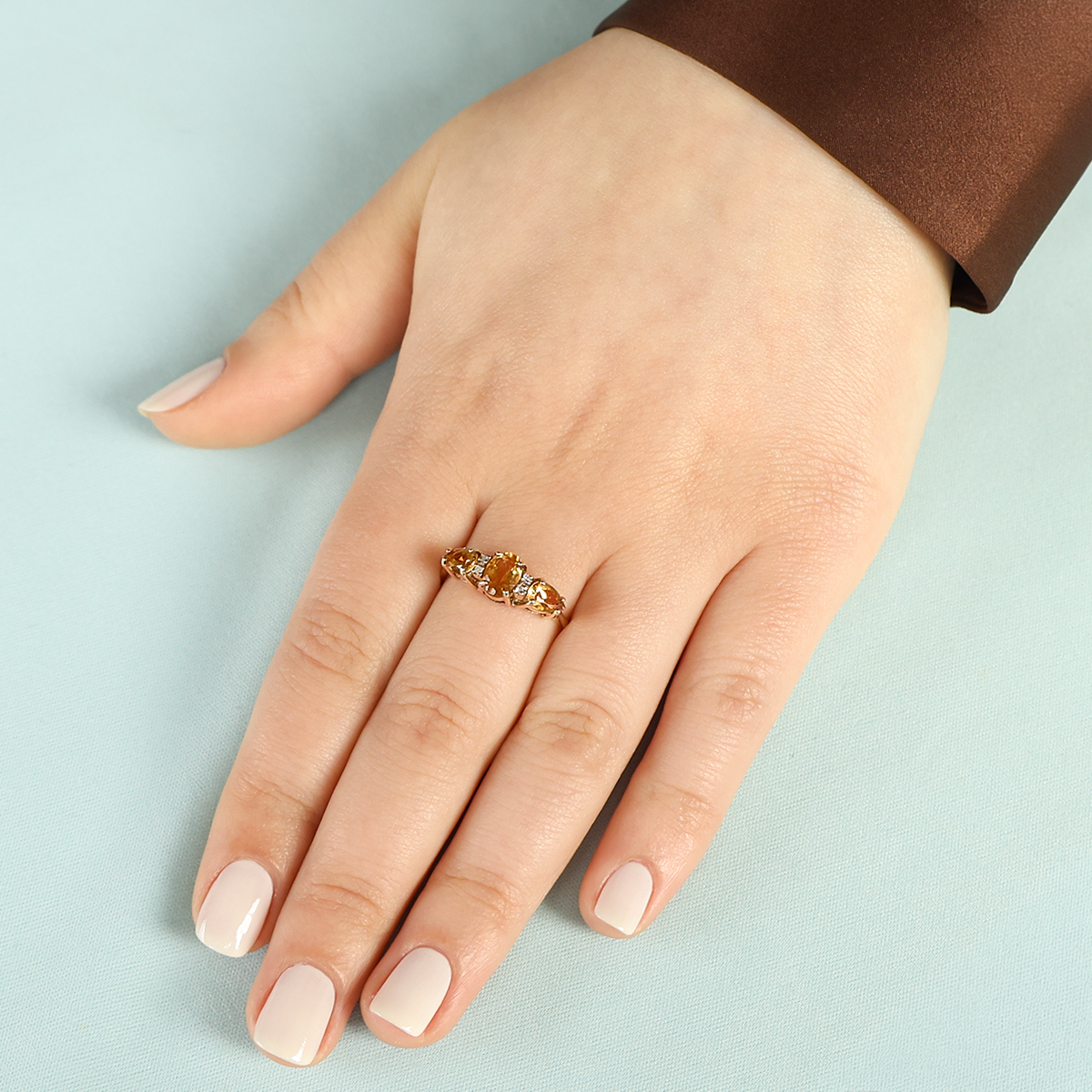 Model wears 9ct Yellow Gold Citrine & Diamond Seven Stone Ring