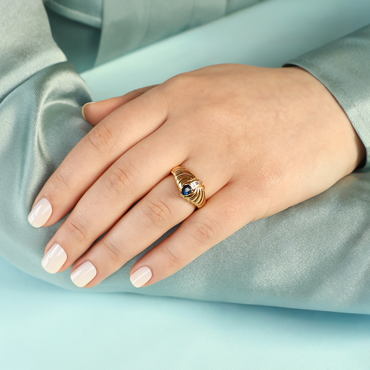 Model wears 18ct Yellow Gold Pear Shaped Sapphire & Tapered Baguette Cut Diamond Ring