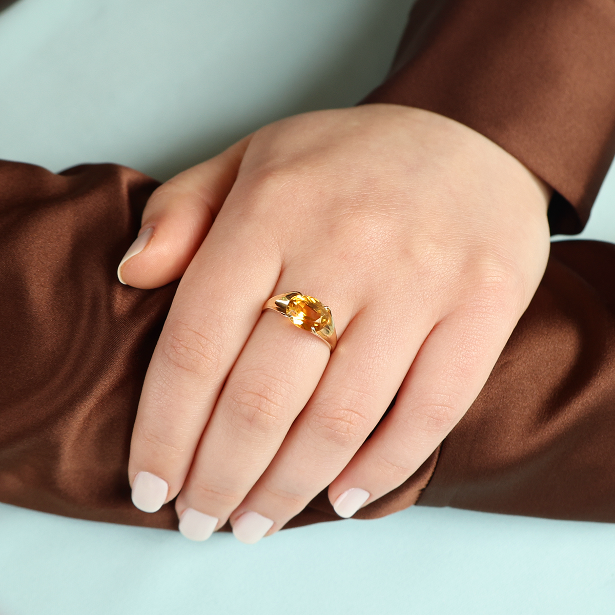 Model wears 9ct Yellow Gold Horizontal Set Oval Cut Citrine Solitaire Ring