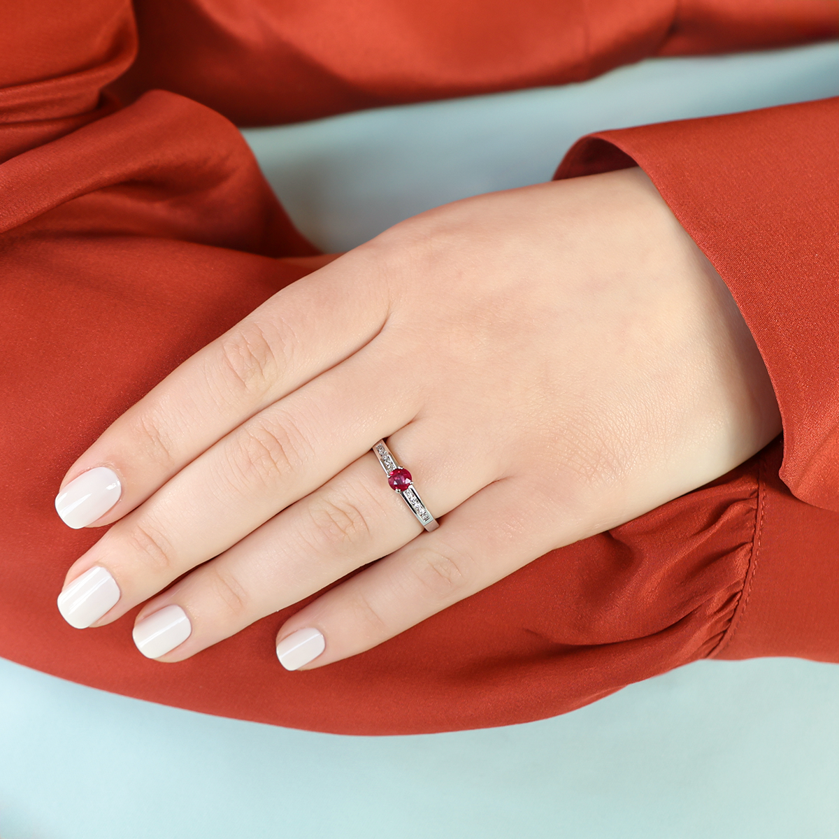 Model wears 18ct White Gold Ruby & Diamond Channel Set Shoulders Solitaire Ring