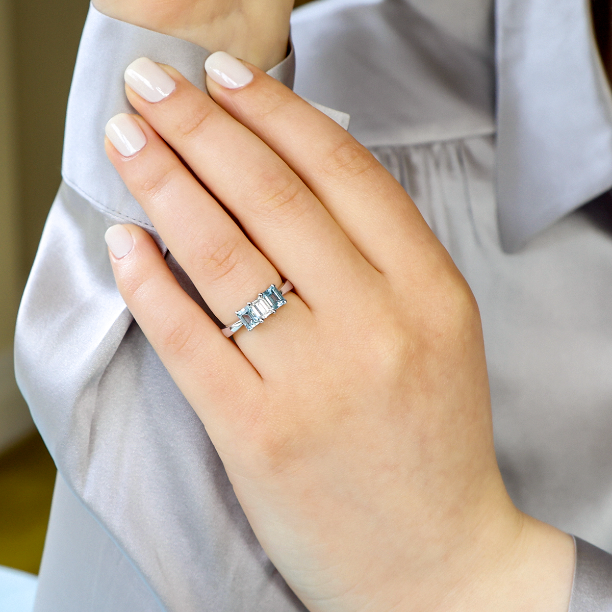 Model wears 18ct White Gold Diamond & Aquamarine Trilogy Ring