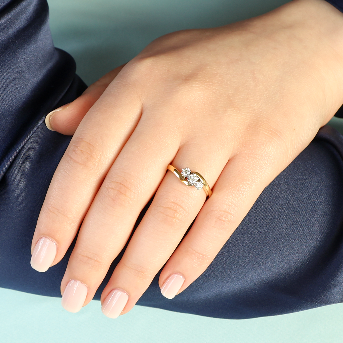 Model wears 18ct Yellow Gold 0.33ctw Diamond Trilogy Twist Ring
