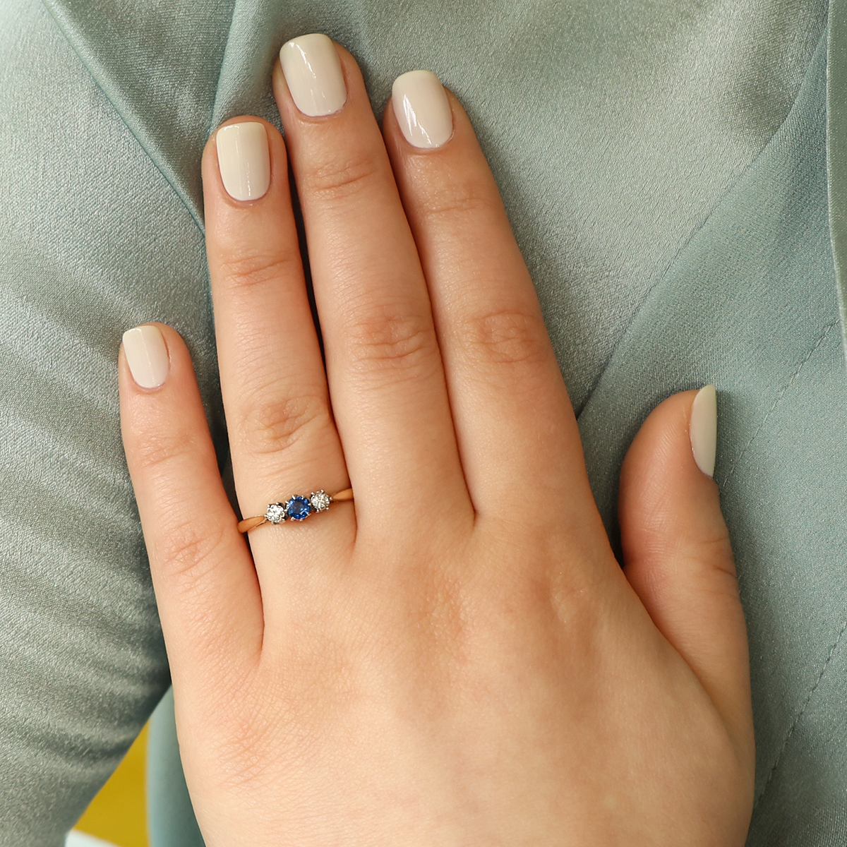 Model wears Un-hallamarked 9ct Yellow Gold & Platinum Sapphire & Diamond Trilogy Ring