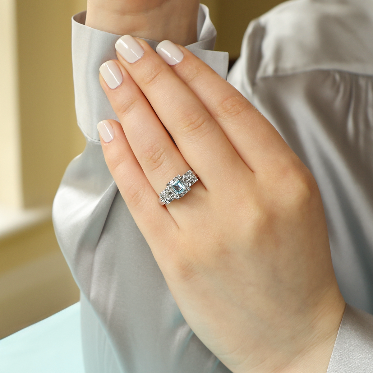 Model wears 9ct White Gold "Le Coeur" Sky Blue Topaz & Diamond Ring