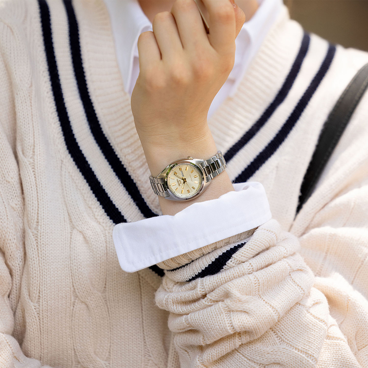 Model wears Seiko 5 Sports 'Hebitama' SNXS In Double Cream - SRE023K1